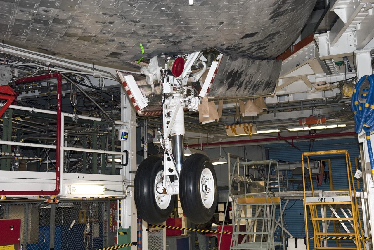 CAPE CANAVERAL, Fla. - In Orbiter Processing Facility-1 at NASA's Kennedy Space Center in Florida, shuttle Atlantis' landing gear is being pressure tested for weight-bearing loads in preparation of it move, or "rollover," to the Vehicle Assembly Building where it will be joined with the external fuel tank and solid rocket boosters on the mobile launcher platform. Atlantis is being prepared for the STS-135 mission, which will deliver the Raffaello multipurpose logistics module packed with supplies, logistics and spare parts to the International Space Station. STS-135 is targeted to launch June 28, and will be the last spaceflight for the Space Shuttle Program. Photo credit: NASA/Jim Grossmann
