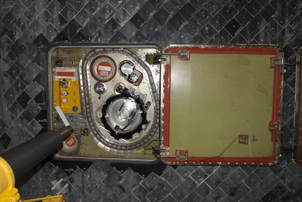 CAPE CANAVERAL, Fla. - In Orbiter Processing Facility-1 at NASA's Kennedy Space Center in Florida, this image shows in detail a view of the hydraulic system connected to the underside of shuttle Atlantis that will lift the vehicle off the floor to enable the orbiter transport system, or OTS, to be rolled underneath for its move, or "rollover," to the Vehicle Assembly Building. Once there Atlantis will be joined with the external fuel tank and solid rocket boosters on the mobile launcher platform. Atlantis is being prepared for the STS-135 mission, which will deliver the Raffaello multipurpose logistics module packed with supplies, logistics and spare parts to the International Space Station. STS-135 is targeted to launch June 28, and will be the last spaceflight for the Space Shuttle Program. Photo credit: NASA/Jim Grossmann