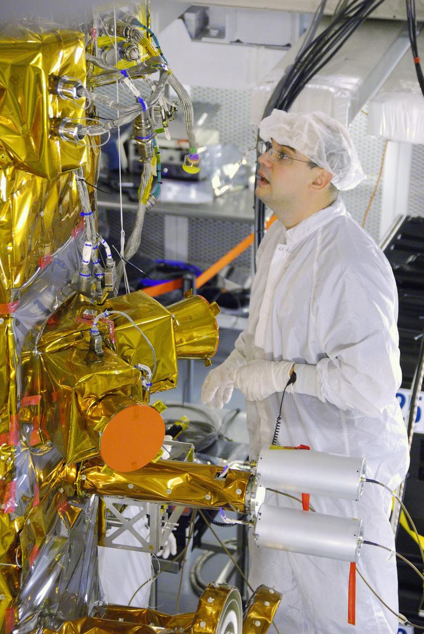 VANDENBERG AIR FORCE BASE, Calif. -- In Space Systems International's Payload Processing Facility at Vandenberg Air Force Base in California, technicians prepare to rotate the Aquarius/SAC-D spacecraft from a vertical to horizontal position for testing. Following final tests, the spacecraft will be integrated to a United Launch Alliance Delta II rocket in preparation for the targeted June launch. Aquarius, the NASA-built primary instrument on the SAC-D spacecraft, will provide new insights into how variations in ocean surface salinity relate to fundamental climate processes on its three-year mission.  Photo credit: NASA/Randy Beaudoin, VAFB