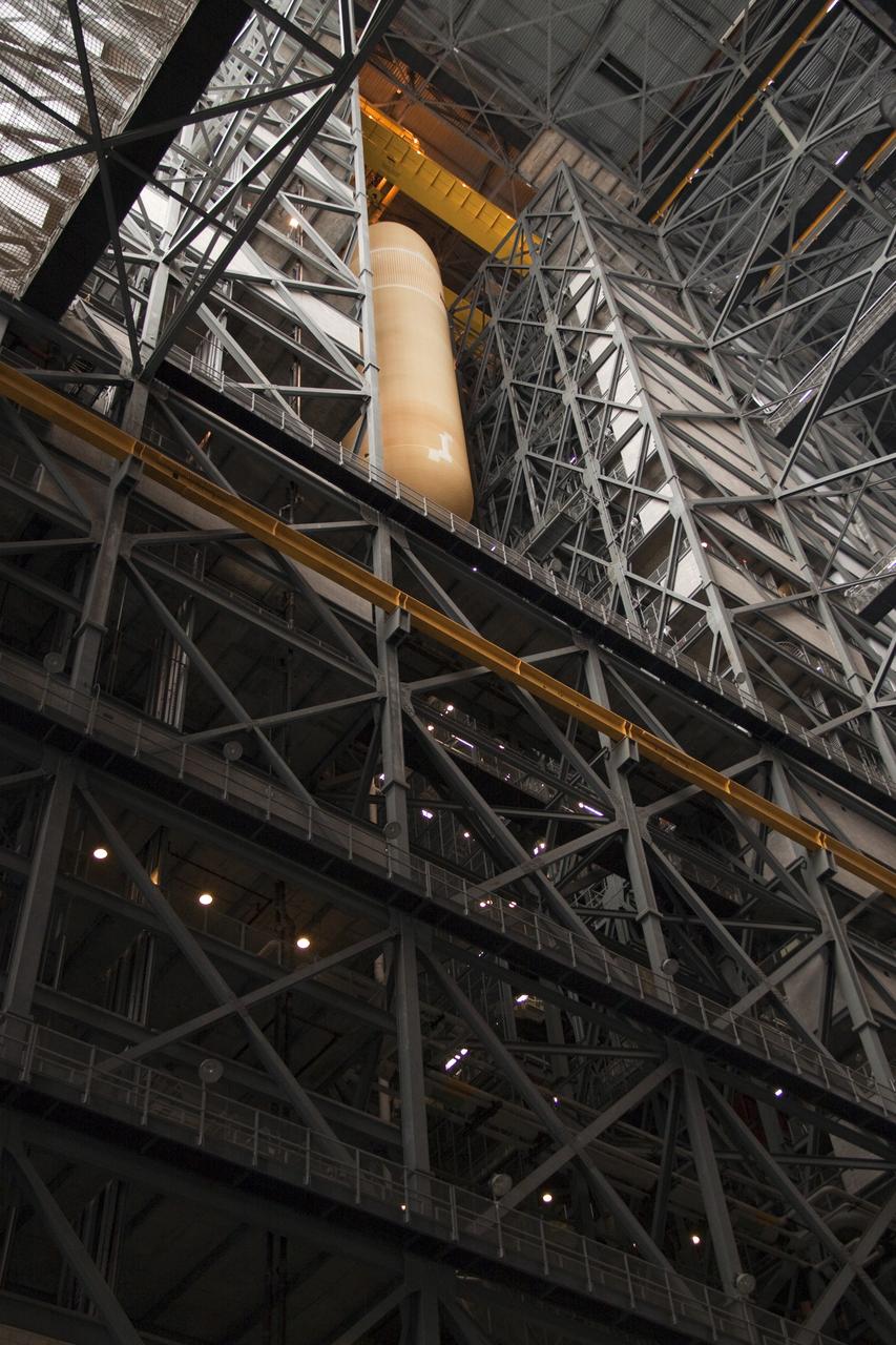 CAPE CANAVERAL, Fla. - In the Vehicle Assembly Building (VAB) at NASA's Kennedy Space Center in Florida, external fuel tank, ET-138, for space shuttle Atlantis' STS-135 mission, is transferred to high bay-1 for joining with the twin solid rocket boosters on the mobile launcher platform. Shuttle Atlantis' move, or "rollover," from Orbiter Processing Facility-1 to the VAB is targeted for May 10. Once there it will be mated with the external tank and boosters. Atlantis and its crew of four will deliver the Raffaello multipurpose logistics module packed with supplies and spare parts to the International Space Station. STS-135 is targeted to launch June 28, and will be the last spaceflight for the Space Shuttle Program. Photo credit: NASA/Jack Pfaller