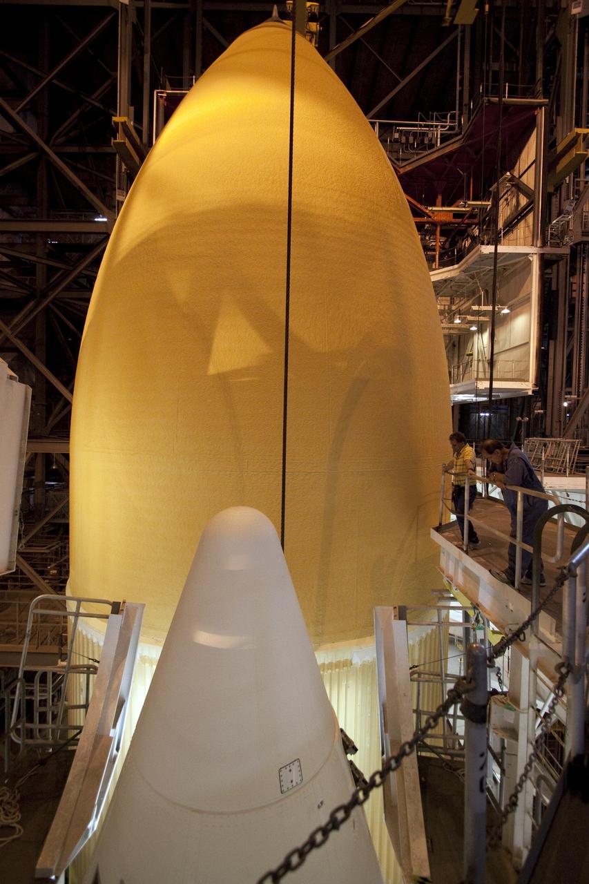 CAPE CANAVERAL, Fla. - In the Vehicle Assembly Building (VAB) at NASA's Kennedy Space Center in Florida, external fuel tank, ET-138, for space shuttle Atlantis' STS-135 mission, is positioned between the twin solid rocket boosters on the mobile launcher platform in high bay-1. Shuttle Atlantis' move, or "rollover," from Orbiter Processing Facility-1 to the VAB is targeted for May 10. Once there it will be mated with the external tank and boosters. Atlantis and its crew of four will deliver the Raffaello multipurpose logistics module packed with supplies and spare parts to the International Space Station. STS-135 is targeted to launch June 28, and will be the last spaceflight for the Space Shuttle Program. Photo credit: NASA/Jack Pfaller