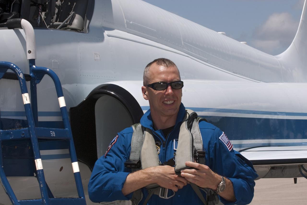 CAPE CANAVERAL, Fla. -- At NASA Kennedy Space Center's Shuttle Landing Facility in Florida, STS-134 Mission Specialist Andrew Feustel disembarks from his T-38 jet. The STS-134 crew members landed at 12:52 p.m. EDT to get ready for shuttle Endeavour's launch to the International Space Station scheduled for Friday, April 29 at 3:47 p.m. Endeavour and its crew will deliver the Express Logistics Carrier-3, Alpha Magnetic Spectrometer-2 (AMS), a high-pressure gas tank and additional spare parts for the Dextre robotic helper to the station. This will be the final spaceflight for Endeavour. For more information visit, www.nasa.gov/mission_pages/shuttle/shuttlemissions/sts134/index.html. Photo credit: NASA/Kim Shiflett
