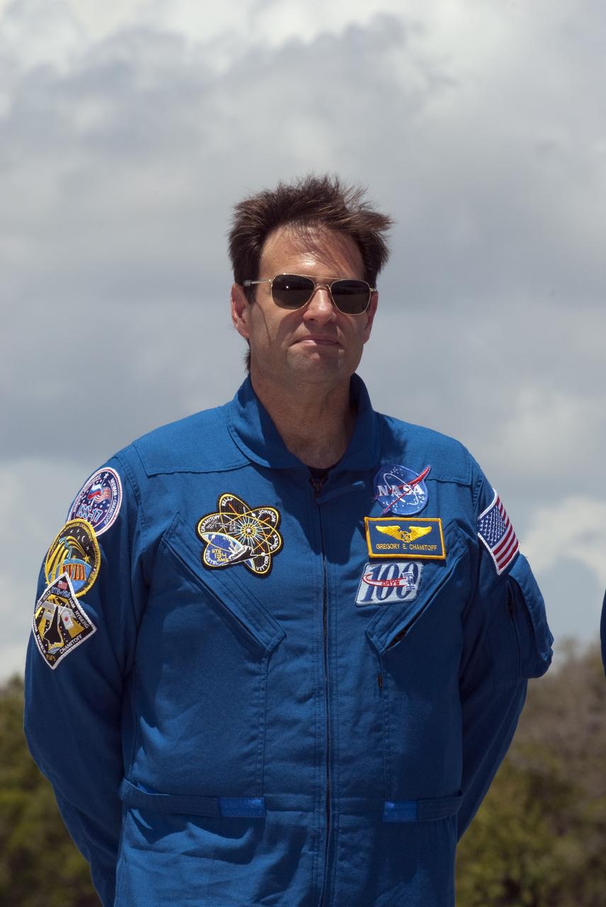 CAPE CANAVERAL, Fla. -- At the Shuttle Landing Facility at NASA's Kennedy Space Center in Florida, Mission Specialist Greg Chamitoff is photographed after his arrival. The STS-134 crew members landed at 12:52 p.m. EDT to get ready for space shuttle Endeavour's launch to the International Space Station scheduled for Friday, April 29 at 3:47 p.m. Endeavour and its crew will deliver the Express Logistics Carrier-3, Alpha Magnetic Spectrometer-2 (AMS), a high-pressure gas tank and additional spare parts for the Dextre robotic helper to the station. This will be the final spaceflight for Endeavour. For more information visit, www.nasa.gov/mission_pages/shuttle/shuttlemissions/sts134/index.html. Photo credit: NASA/Kim Shiflett