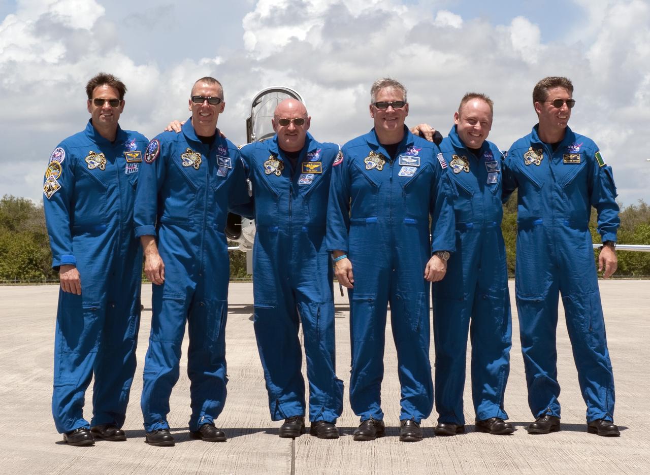 CAPE CANAVERAL, Fla. -- The six STS-134 astronauts pause for a photo after arrival at NASA Kennedy Space Center's Shuttle Landing Facility in Florida, to begin final launch preparations for space shuttle Endeavour's mission to the International Space Station. From left are Mission Specialists Greg Chamitoff, Andrew Feustel, Commander Mark Kelly, Pilot Greg H. Johnson, Mission Specialist Mike Fincke and European Space Agency astronaut Roberto Vittori. Endeavour and its crew will deliver the Express Logistics Carrier-3, Alpha Magnetic Spectrometer-2 (AMS), a high-pressure gas tank and additional spare parts for the Dextre robotic helper to the station. This will be the final spaceflight for Endeavour. For more information visit, www.nasa.gov/mission_pages/shuttle/shuttlemissions/sts134/index.html. Photo credit: NASA/Kim Shiflett