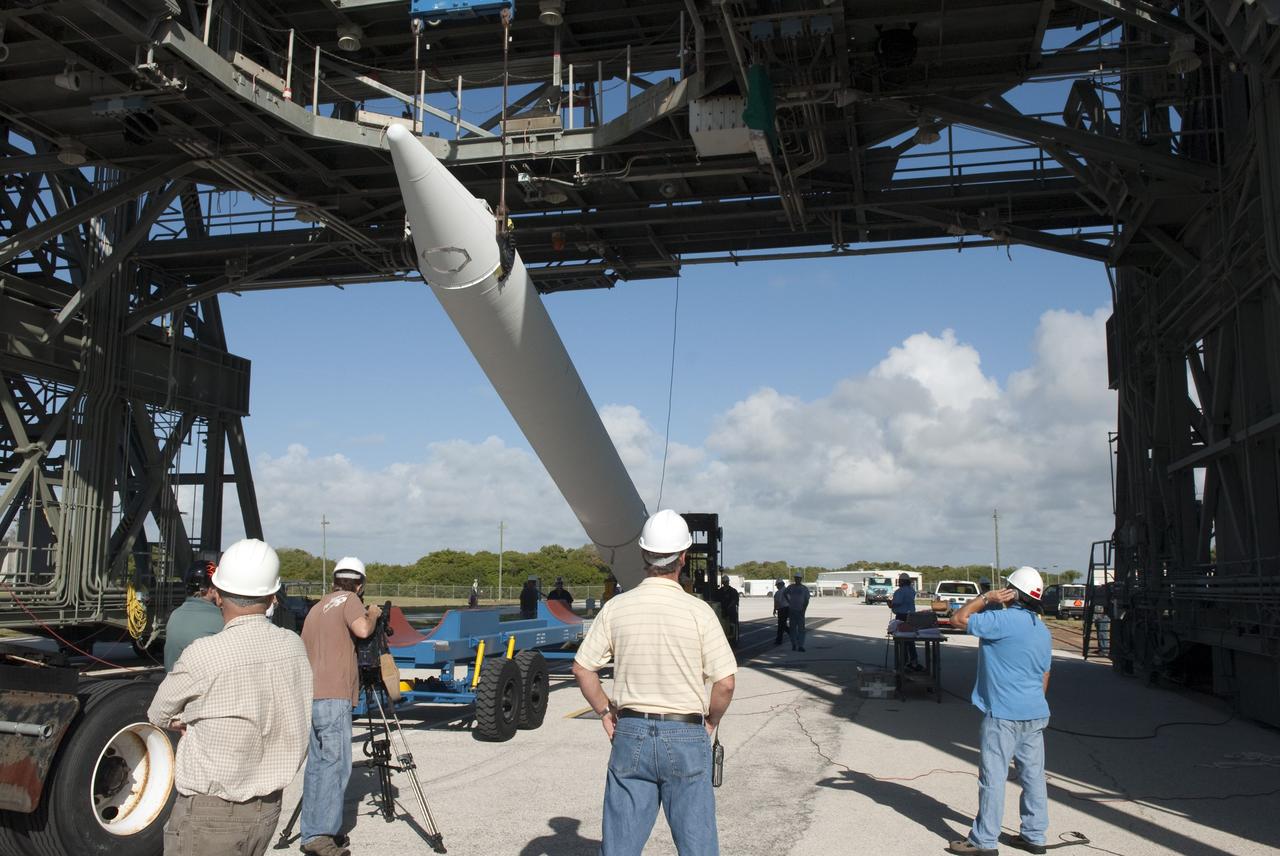 CAPE CANAVERAL, Fla. -- A solid-fueled booster is lifted off a trailer at Launch Complex 17-B at Cape Canaveral Air Force Station in Florida where a United Launch Alliance Delta II is being prepared for launch. The Delta II will carry NASA's Gravity Recovery and Interior Laboratory, or GRAIL, spacecraft into lunar orbit. The GRAIL mission is a part of NASA's Discovery Program. GRAIL will fly twin spacecraft in tandem orbits around the moon for several months to measure its gravity field. The mission also will answer longstanding questions about Earth's moon and provide scientists a better understanding of how Earth and other rocky planets in the solar system formed. GRAIL is scheduled to launch September 8, 2011. For more information visit: http://science.nasa.gov/missions/grail/. Photo credit: NASA/Jim Grossmann