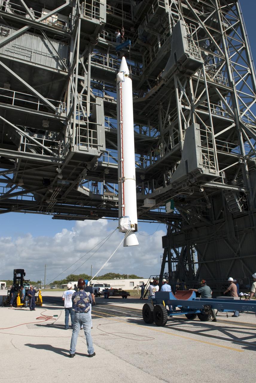 CAPE CANAVERAL, Fla. -- A solid-fueled booster is lifted into Launch Complex 17-B at Cape Canaveral Air Force Station in Florida where a United Launch Alliance Delta II is being prepared for launch. The Delta II will carry NASA's Gravity Recovery and Interior Laboratory, or GRAIL, spacecraft into lunar orbit. The GRAIL mission is a part of NASA's Discovery Program. GRAIL will fly twin spacecraft in tandem orbits around the moon for several months to measure its gravity field. The mission also will answer longstanding questions about Earth's moon and provide scientists a better understanding of how Earth and other rocky planets in the solar system formed. GRAIL is scheduled to launch September 8, 2011. For more information visit: http://science.nasa.gov/missions/grail/. Photo credit: NASA/Jim Grossmann