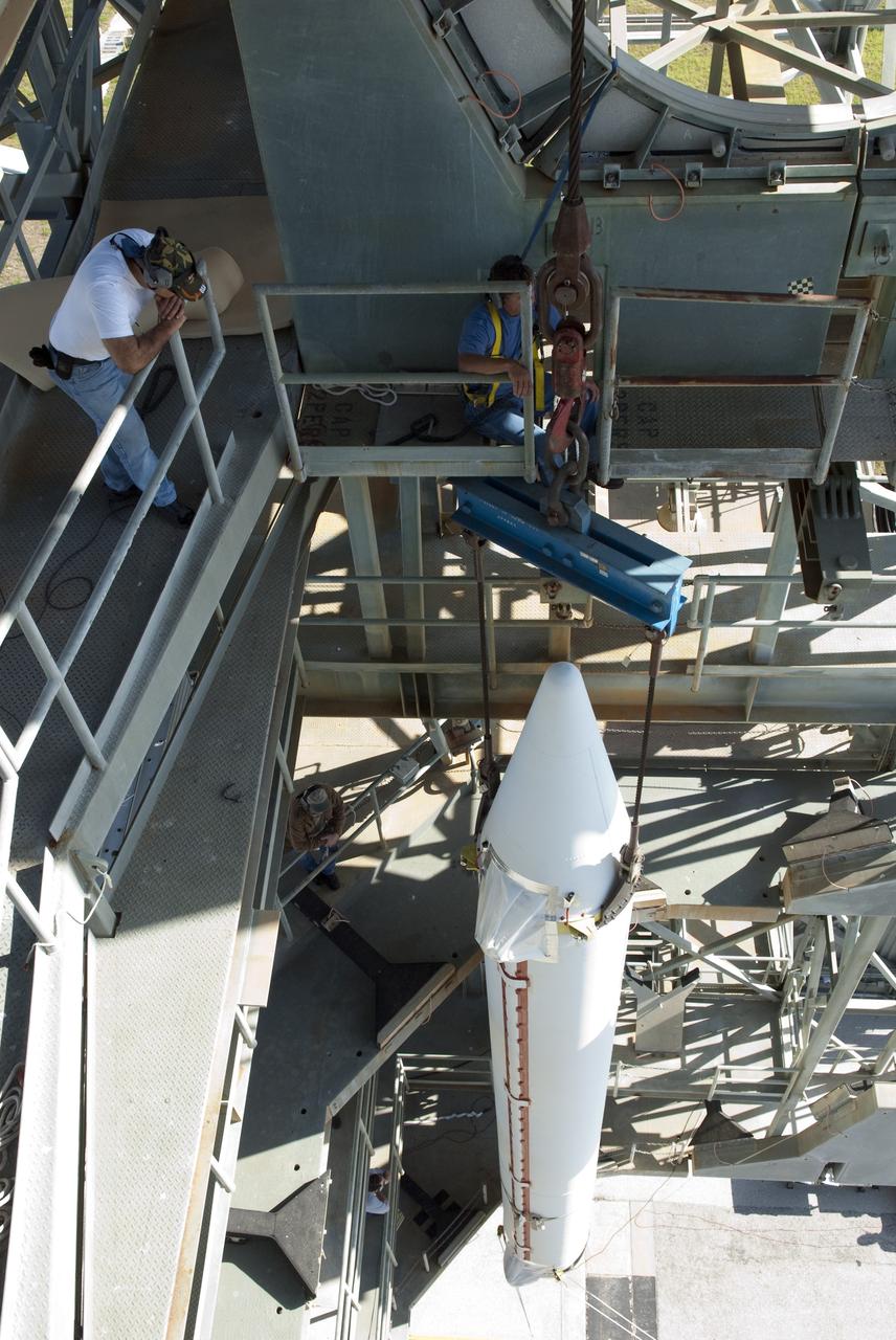 CAPE CANAVERAL, Fla. -- Technicians guide a solid-fueled booster as it is lifted into Launch Complex 17-B at Cape Canaveral Air Force Station in Florida where a United Launch Alliance Delta II is being prepared for launch. The Delta II will carry NASA's Gravity Recovery and Interior Laboratory, or GRAIL, spacecraft into lunar orbit. The GRAIL mission is a part of NASA's Discovery Program. GRAIL will fly twin spacecraft in tandem orbits around the moon for several months to measure its gravity field. The mission also will answer longstanding questions about Earth's moon and provide scientists a better understanding of how Earth and other rocky planets in the solar system formed. GRAIL is scheduled to launch September 8, 2011. For more information visit: http://science.nasa.gov/missions/grail/. Photo credit: NASA/Jim Grossmann