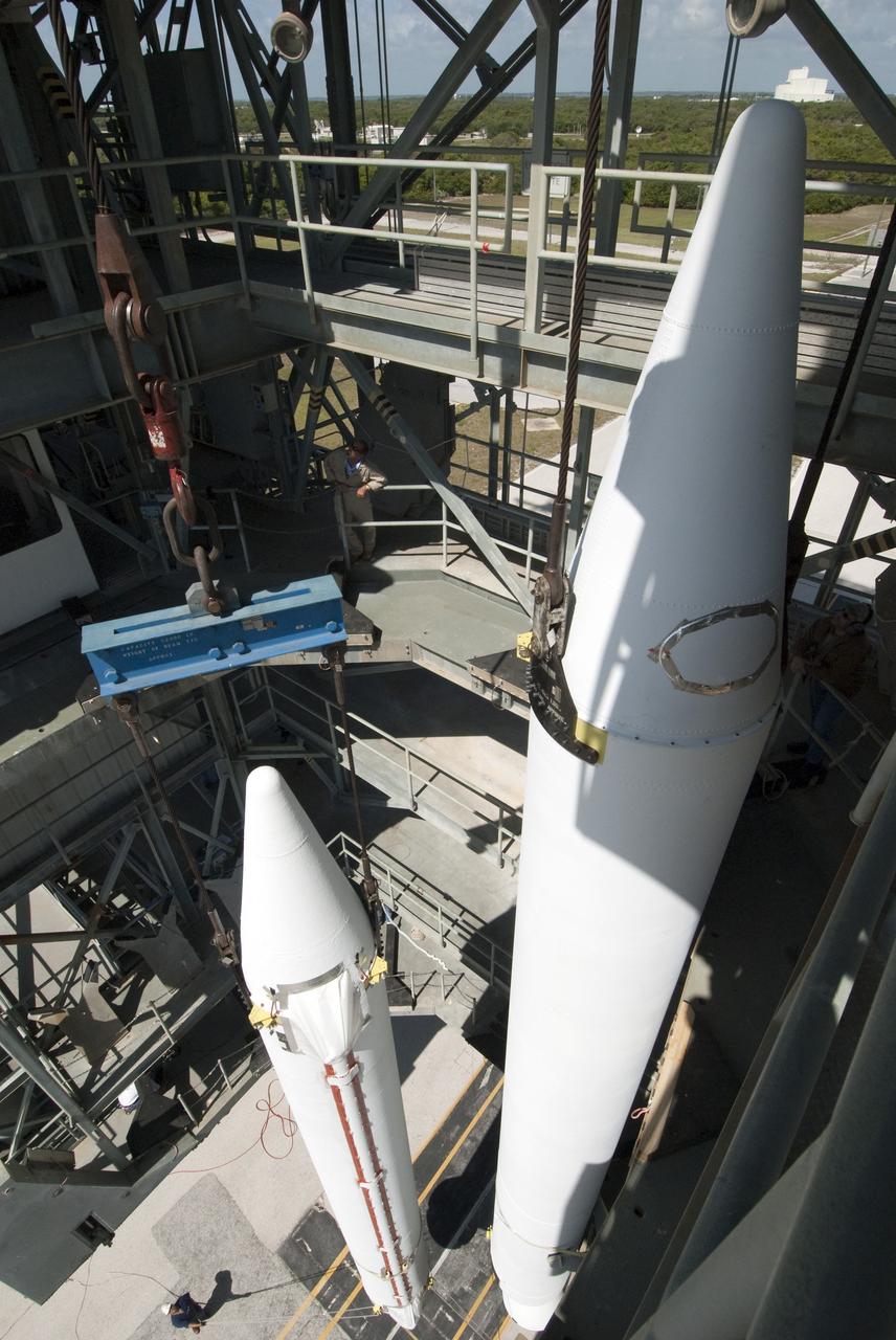 CAPE CANAVERAL, Fla. -- A solid-fueled booster is lifted into Launch Complex 17-B at Cape Canaveral Air Force Station in Florida where a United Launch Alliance Delta II is being prepared for launch. The Delta II will carry NASA's Gravity Recovery and Interior Laboratory, or GRAIL, spacecraft into lunar orbit. The GRAIL mission is a part of NASA's Discovery Program. GRAIL will fly twin spacecraft in tandem orbits around the moon for several months to measure its gravity field. The mission also will answer longstanding questions about Earth's moon and provide scientists a better understanding of how Earth and other rocky planets in the solar system formed. GRAIL is scheduled to launch September 8, 2011. For more information visit: http://science.nasa.gov/missions/grail/. Photo credit: NASA/Jim Grossmann