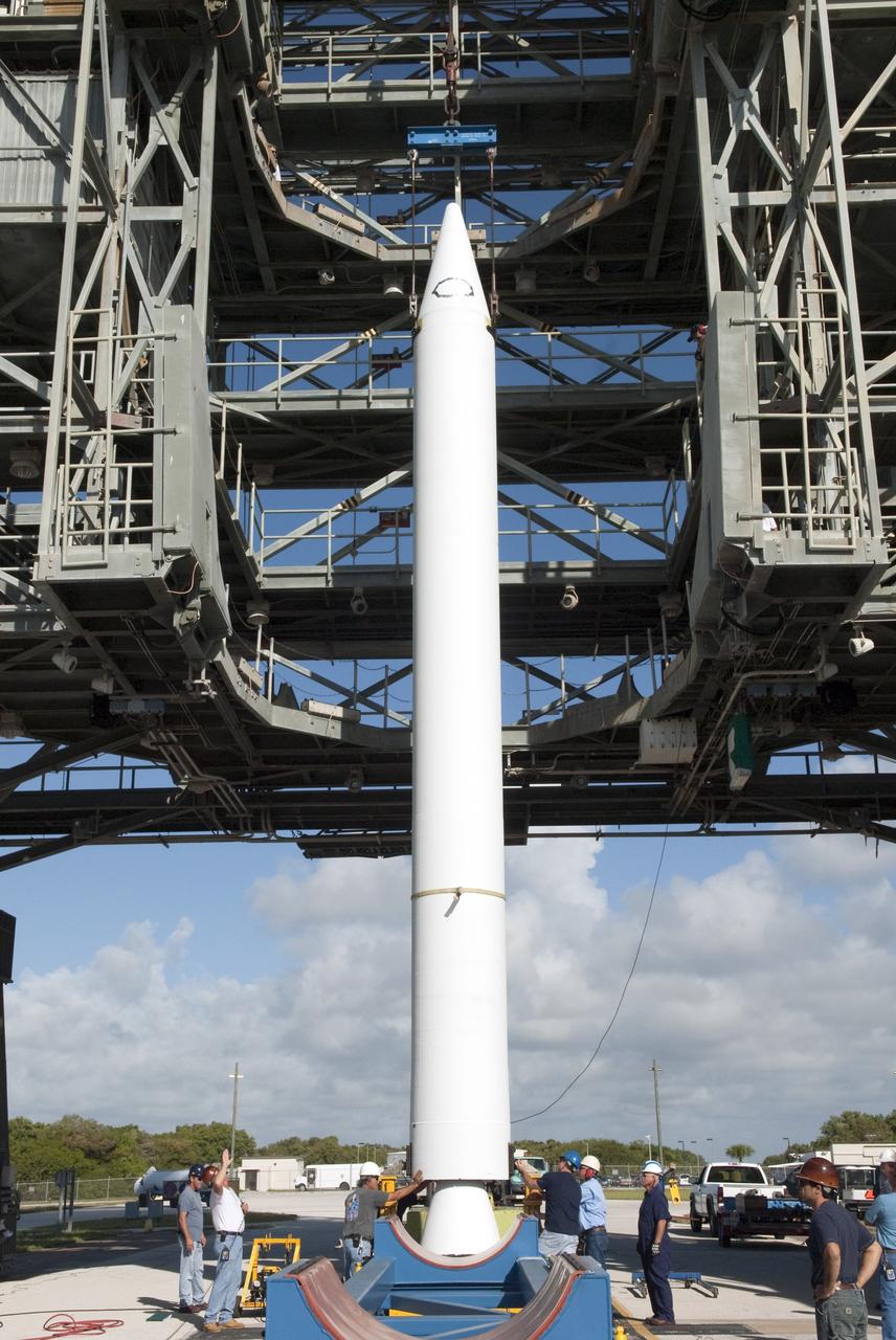 CAPE CANAVERAL, Fla. -- A solid-fueled booster is lifted into Launch Complex 17-B at Cape Canaveral Air Force Station in Florida where a United Launch Alliance Delta II is being prepared for launch. The Delta II will carry NASA's Gravity Recovery and Interior Laboratory, or GRAIL, spacecraft into lunar orbit. The GRAIL mission is a part of NASA's Discovery Program. GRAIL will fly twin spacecraft in tandem orbits around the moon for several months to measure its gravity field. The mission also will answer longstanding questions about Earth's moon and provide scientists a better understanding of how Earth and other rocky planets in the solar system formed. GRAIL is scheduled to launch September 8, 2011. For more information visit: http://science.nasa.gov/missions/grail/. Photo credit: NASA/Jim Grossmann