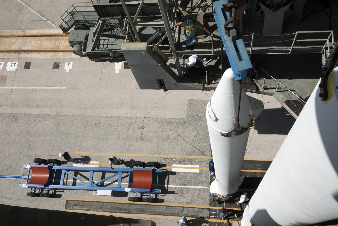 CAPE CANAVERAL, Fla. -- A solid-fueled booster is lifted into Launch Complex 17-B at Cape Canaveral Air Force Station in Florida where a United Launch Alliance Delta II is being prepared for launch. The Delta II will carry NASA's Gravity Recovery and Interior Laboratory, or GRAIL, spacecraft into lunar orbit. The GRAIL mission is a part of NASA's Discovery Program. GRAIL will fly twin spacecraft in tandem orbits around the moon for several months to measure its gravity field. The mission also will answer longstanding questions about Earth's moon and provide scientists a better understanding of how Earth and other rocky planets in the solar system formed. GRAIL is scheduled to launch September 8, 2011. For more information visit: http://science.nasa.gov/missions/grail/. Photo credit: NASA/Jim Grossmann