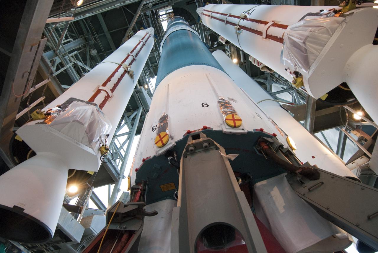 CAPE CANAVERAL, Fla. -- Solid-fueled boosters are positioned beside the first stage of a United Launch Alliance Delta II rocket in preparation for attachment. The boosters are being attached to the rocket at Launch Complex 17-B at Cape Canaveral Air Force Station in Florida. The Delta II will carry NASA's Gravity Recovery and Interior Laboratory, or GRAIL, spacecraft into lunar orbit. The GRAIL mission is a part of NASA's Discovery Program. GRAIL will fly twin spacecraft in tandem orbits around the moon for several months to measure its gravity field. The mission also will answer longstanding questions about Earth's moon and provide scientists a better understanding of how Earth and other rocky planets in the solar system formed. GRAIL is scheduled to launch September 8, 2011. For more information visit: http://science.nasa.gov/missions/grail/. Photo credit: NASA/Jim Grossmann
