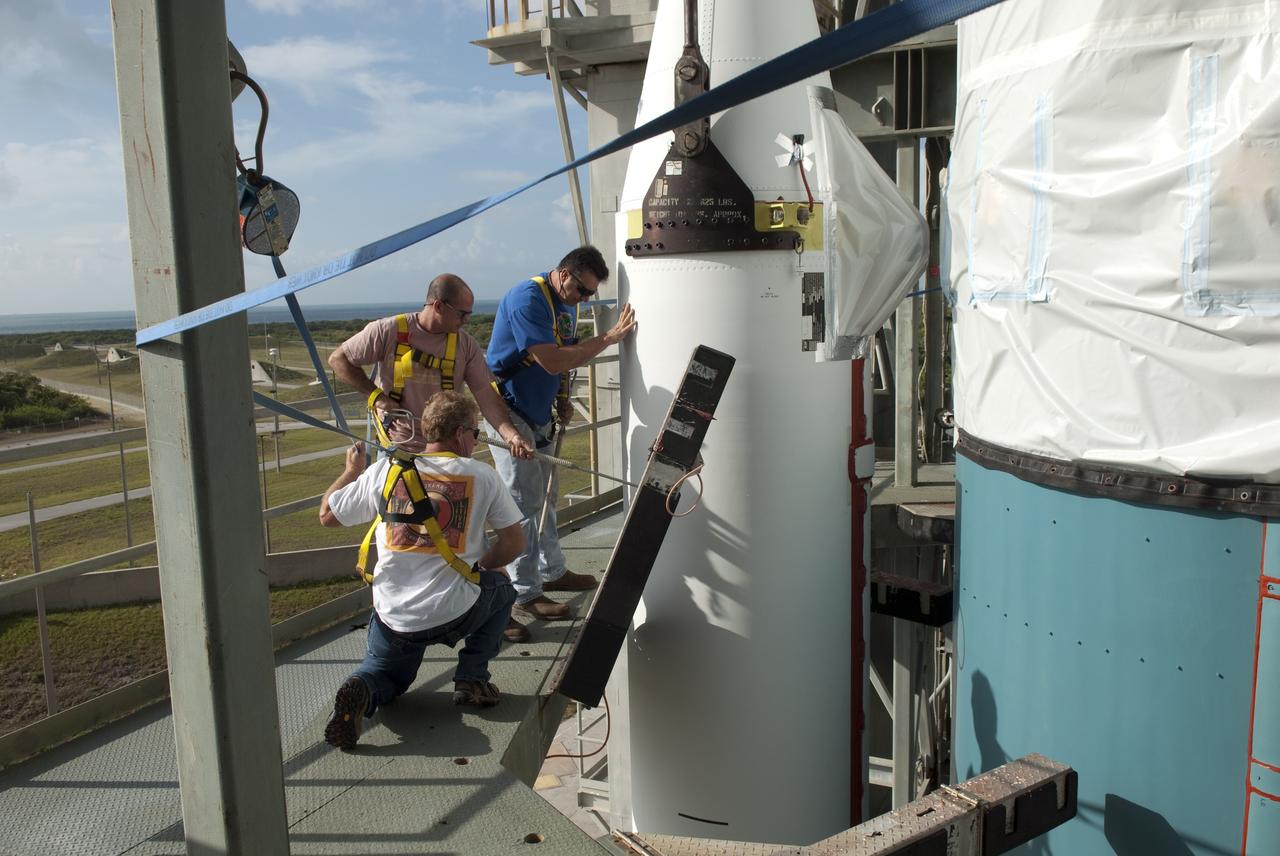 CAPE CANAVERAL, Fla. -- Technicians working at Launch Complex 17-B at Cape Canaveral Air Force Station in Florida prepare a solid-fueled rocket booster for connection to the first stage of a United Launch Alliance Delta II rocket. The Delta II will carry NASA's Gravity Recovery and Interior Laboratory, or GRAIL, spacecraft into lunar orbit. The GRAIL mission is a part of NASA's Discovery Program. GRAIL will fly twin spacecraft in tandem orbits around the moon for several months to measure its gravity field. The mission also will answer longstanding questions about Earth's moon and provide scientists a better understanding of how Earth and other rocky planets in the solar system formed. GRAIL is scheduled to launch September 8, 2011. For more information visit: http://science.nasa.gov/missions/grail/. Photo credit: NASA/Jim Grossmann