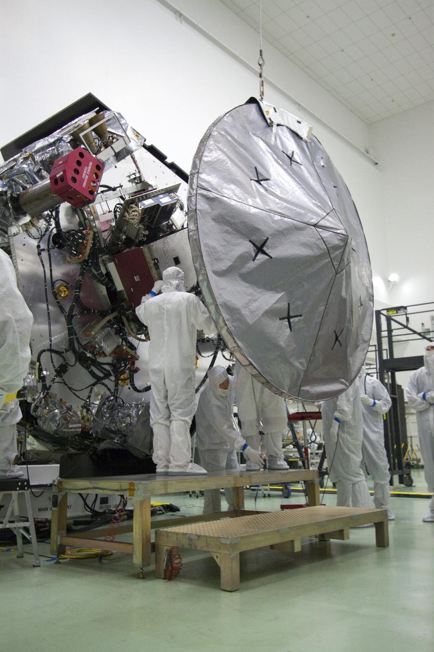 CAPE CANAVERAL, Fla. -- Technicians at Astrotech's payload processing facility in Titusville, Fla. install the high-gain antenna to NASA's Juno spacecraft. Juno is scheduled to launch aboard an Atlas V rocket from Cape Canaveral, Fla. Aug. 5.The solar-powered spacecraft will orbit Jupiter's poles 33 times to find out more about the gas giant's origins, structure, atmosphere and magnetosphere and investigate the existence of a solid planetary core. For more information visit, www.nasa.gov/juno. Photo credit: NASA/Jack Pfaller
