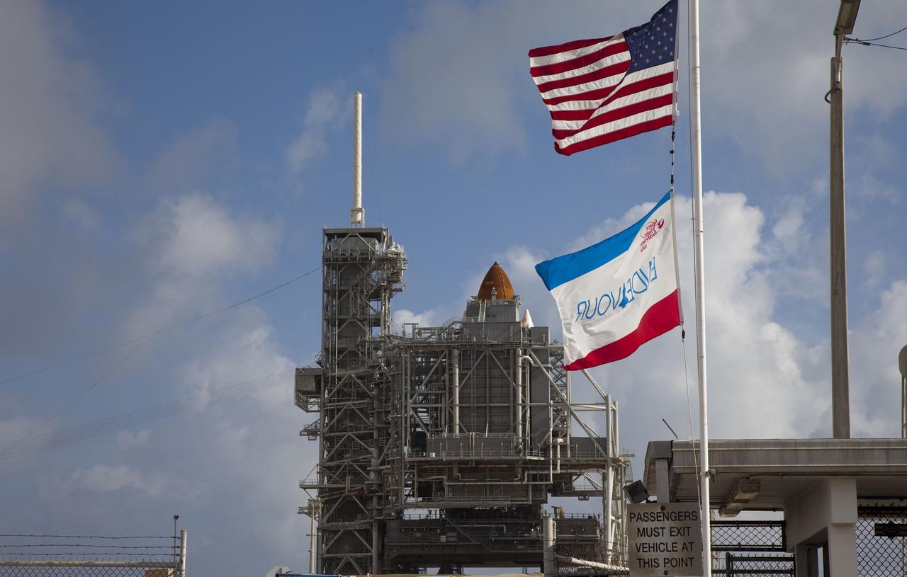 CAPE CANAVERAL, Fla. -- The flags at Launch Pad 39A at NASA's Kennedy Space Center in Florida catch the offshore breeze as space shuttle Endeavour awaits liftoff. The rotating service structure (RSS) surrounds the shuttle for protection and to provide access but will be retracted before launch. Endeavour and its crew will deliver the Express Logistics Carrier-3, Alpha Magnetic Spectrometer-2 (AMS), a high-pressure gas tank and additional spare parts for the Dextre robotic helper to the International Space Station. Launch is scheduled for April 29 at 3:47 p.m. EDT. This will be the final spaceflight for Endeavour. For more information visit, www.nasa.gov/mission_pages/shuttle/shuttlemissions/sts134/index.html. Photo credit: NASA/Frank Michaux