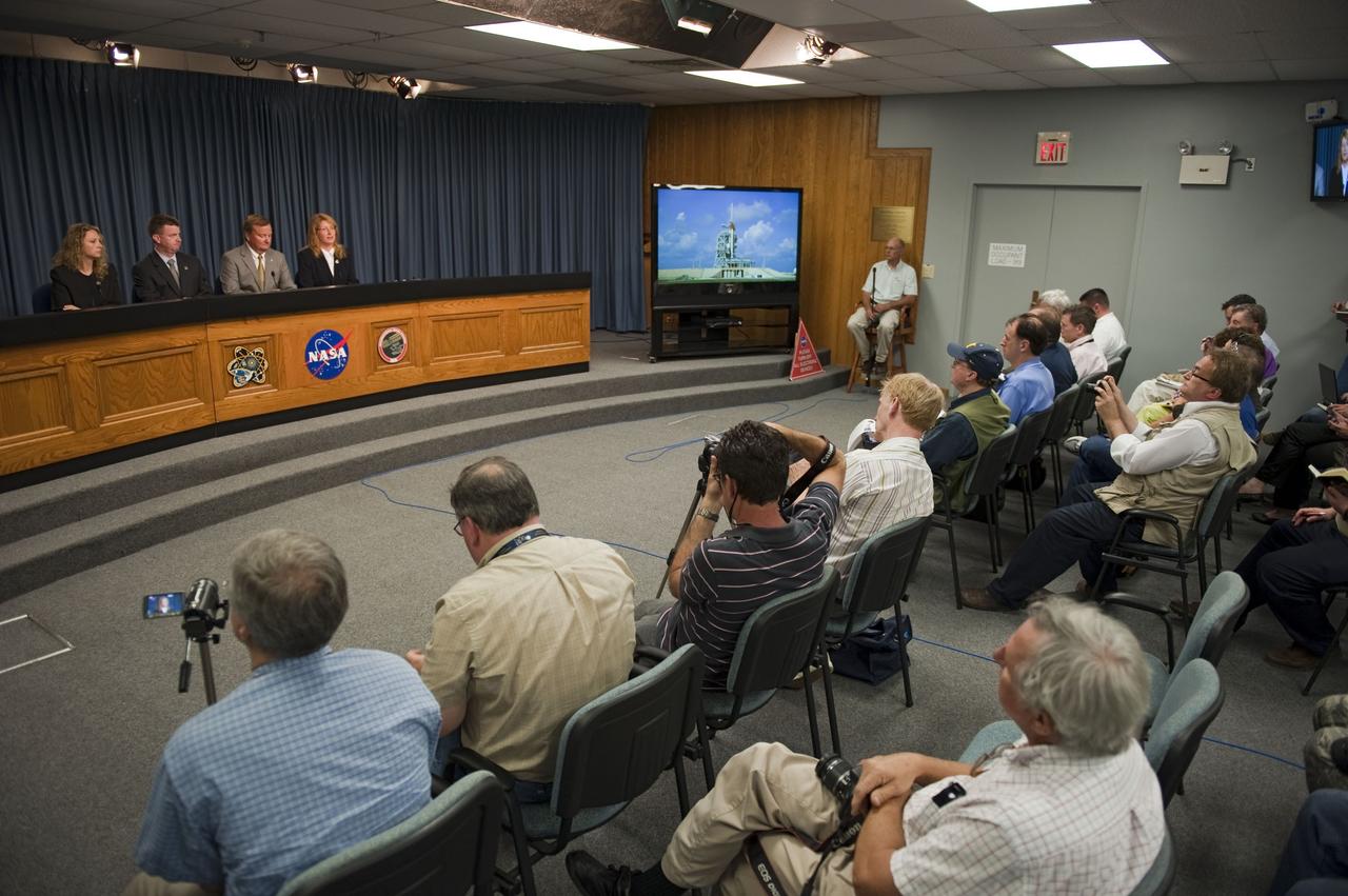 CAPE CANAVERAL, Fla. -- In the Press Site auditorium at NASA's Kennedy Space Center in Florida, NASA managers brief media about the launch status of space shuttle Endeavour's STS-134 mission. From left are NASA Public Affairs Officer Candrea Thomas, Space Shuttle Program Launch Integration Manager, Mike Moses, Shuttle Launch Director, Mike Leinbach, and Shuttle Weather Officer, Kathy Winters. Endeavour and its crew will deliver the Express Logistics Carrier-3, Alpha Magnetic Spectrometer-2 (AMS), a high-pressure gas tank and additional spare parts for the Dextre robotic helper to the International Space Station. Launch is scheduled for April 29 at 3:47 p.m. EDT. This will be the final spaceflight for Endeavour. For more information visit, www.nasa.gov/mission_pages/shuttle/shuttlemissions/sts134/index.html. Photo credit: NASA/Kim Shiflett