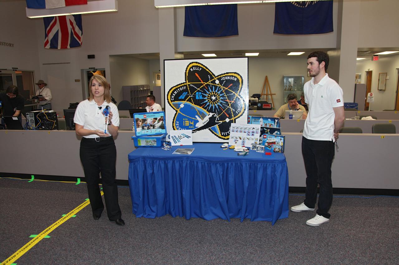 CAPE CANAVERAL, Fla. -- In the Press Site bull pen at NASA's Kennedy Space Center in Florida, NASA Education Specialist Teresa Sindelar and The LEGO Group's Daire McCabe talk about the LEGO sets going up to the International Space Station aboard space shuttle Endeavour's STS-134 mission. NASA and The LEGO Group will send 23 LEGO sets to the station and some of those sets include a space shuttle, an ISS model, a Global Positioning Satellite and NASA's Hubble Space Telescope. The sets will be used for NASA's Teaching From Space Project, which is part of a three-year Space Act Agreement with the toy maker to spark the interest of children in science, technology, engineering and mathematics (STEM). Liftoff is scheduled for April 29 at 3:47 p.m. EDT. This will be the final spaceflight for Endeavour. For more information visit, www.nasa.gov/mission_pages/shuttle/shuttlemissions/sts134/index.html. Photo credit: NASA/Frankie Martin