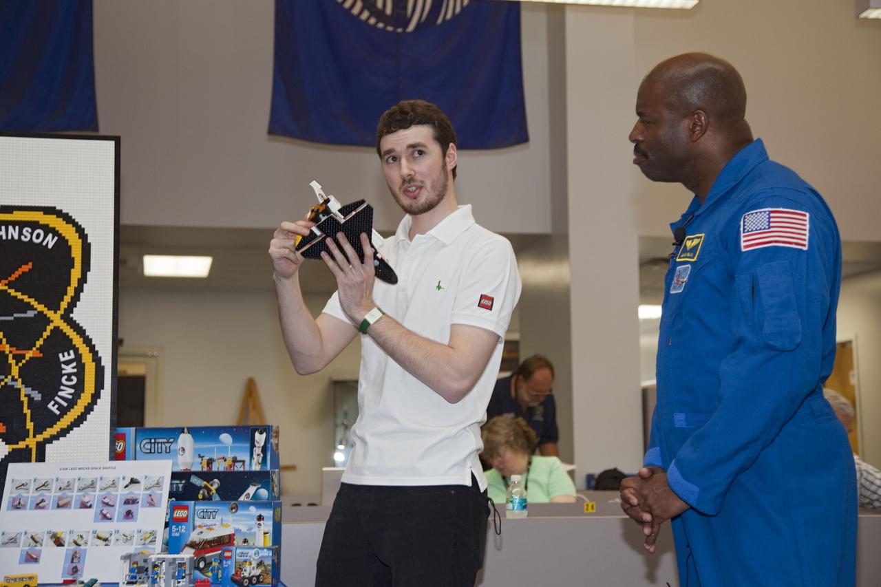 CAPE CANAVERAL, Fla. -- In the Press Site bull pen at NASA's Kennedy Space Center in Florida, The LEGO Group's Daire McCabe and NASA's Associate Administrator for Education Leland Melvin talk about the LEGO sets going up to the International Space Station aboard space shuttle Endeavour's STS-134 mission. NASA and The LEGO Group will send 23 LEGO sets to the station and some of those sets include a space shuttle, an ISS model, a Global Positioning Satellite and NASA's Hubble Space Telescope. The sets will be used for NASA's Teaching From Space Project, which is part of a three-year Space Act Agreement with the toy maker to spark the interest of children in science, technology, engineering and mathematics (STEM). Liftoff is scheduled for April 29 at 3:47 p.m. EDT. This will be the final spaceflight for Endeavour. For more information visit, www.nasa.gov/mission_pages/shuttle/shuttlemissions/sts134/index.html. Photo credit: NASA/Frankie Martin