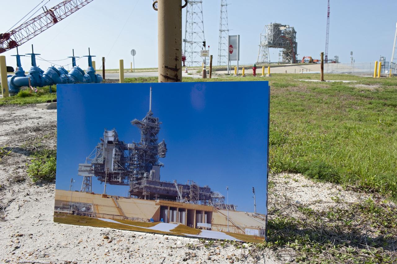 CAPE CANAVERAL, Fla. -- Media representatives participate in a Now and Future Tour at NASA's Kennedy Space Center in Florida. Here, they make a stop at the Launch Pad 39B, which is being restructured for future use. Its new design will feature a "clean pad" for rockets to come with their own launcher, making it more versatile for a number of vehicles. Other stops along the tour included Orbiter Processing Facility-2 (OPF-2) and the Shuttle Landing Facility (SLF). OPF-2 is where shuttle Discovery is being prepared for future public display at the Smithsonian's National Air and Space Museum Steven F. Udvar-Hazy Center in Chantilly, Va. The SLF's runway could be used for private companies and government agencies to host a diversity of launch systems, including orbital and suborbital flights. Photo credit: NASA/Kim Shiflett