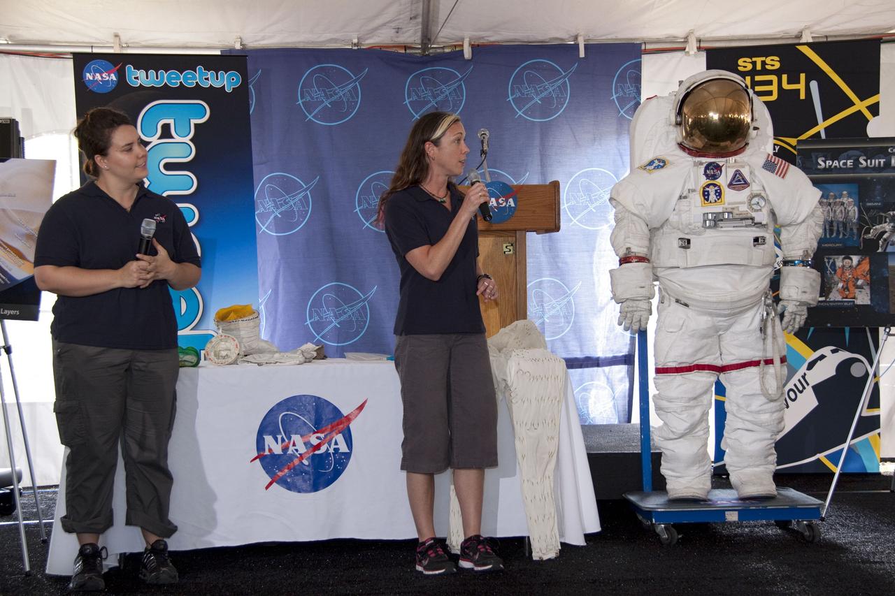 CAPE CANAVERAL, Fla. -- At NASA's Kennedy Space Center in Florida, Mallory Jennings, left, and Heather Paul, aerospace engineers with Johnson Space Center's Spacesuit Life Support, perform a spacesuit demonstration during the STS-134 Tweetup event. About 150 people from 43 states, Washington, D.C., and half a dozen countries are participating in the event. A Tweetup gives followers of @NASA on the social messaging medium Twitter the opportunity to tour the center, view a shuttle launch and speak with NASA managers, astronauts, shuttle technicians and engineers. During the STS-134 mission, space shuttle Endeavour will deliver the Express Logistics Carrier-3, Alpha Magnetic Spectrometer-2 (AMS), a high-pressure gas tank and additional spare parts for the Dextre robotic helper to the International Space Station. Endeavour was scheduled to launch at 3:47 p.m. on April 29, but that attempt was scrubbed for at least 72 hours while engineers assess an issue associated with the shuttle's Auxiliary Power Unit 1. STS-134 will be the final spaceflight for Endeavour. For more information visit, www.nasa.gov/mission_pages/shuttle/shuttlemissions/sts134/index.html. Photo credit: NASA/Jack Pfaller
