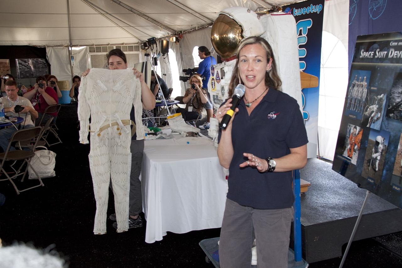 CAPE CANAVERAL, Fla. -- At NASA's Kennedy Space Center in Florida, Mallory Jennings, left, and Heather Paul, aerospace engineers with Johnson Space Center's Spacesuit Life Support, perform a spacesuit demonstration during the STS-134 Tweetup event. About 150 people from 43 states, Washington, D.C., and half a dozen countries are participating in the event. A Tweetup gives followers of @NASA on the social messaging medium Twitter the opportunity to tour the center, view a shuttle launch and speak with NASA managers, astronauts, shuttle technicians and engineers. During the STS-134 mission, space shuttle Endeavour will deliver the Express Logistics Carrier-3, Alpha Magnetic Spectrometer-2 (AMS), a high-pressure gas tank and additional spare parts for the Dextre robotic helper to the International Space Station. Endeavour was scheduled to launch at 3:47 p.m. on April 29, but that attempt was scrubbed for at least 72 hours while engineers assess an issue associated with the shuttle's Auxiliary Power Unit 1. STS-134 will be the final spaceflight for Endeavour. For more information visit, www.nasa.gov/mission_pages/shuttle/shuttlemissions/sts134/index.html. Photo credit: NASA/Jack Pfaller