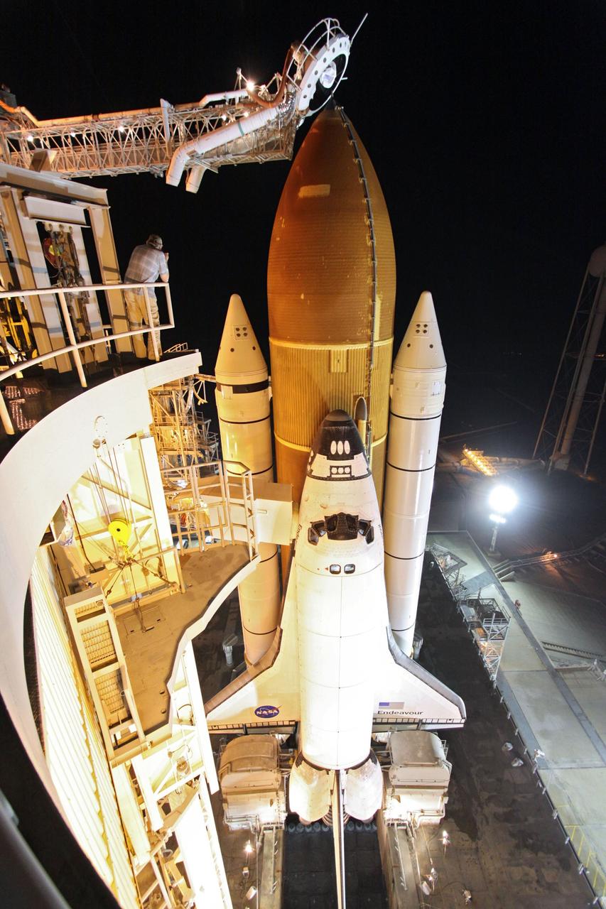 CAPE CANAVERAL, Fla. -- At NASA's Kennedy Space Center in Florida, space shuttle Endeavour is illuminated by bright xenon lights on Launch Pad 39A after the rotating service structure (RSS) was moved away. The structure provides weather protection and access to the shuttle while it awaits lift off on the pad. RSS "rollback," as it's called, began at 11:52 p.m. EDT on April 28. The move was scheduled to begin at 7 p.m., but storms over Kennedy delayed pad operations for a few hours. STS-134 will deliver the Express Logistics Carrier-3, Alpha Magnetic Spectrometer-2 (AMS), a high-pressure gas tank and additional spare parts for the Dextre robotic helper to the International Space Station. Endeavour was scheduled to launch at 3:47 p.m. on April 29, but that attempt was scrubbed for at least 72 hours while engineers assess an issue associated with the shuttle's Auxiliary Power Unit 1. STS-134 will be the final spaceflight for Endeavour. For more information visit, www.nasa.gov/mission_pages/shuttle/shuttlemissions/sts134/index.html. Photo credit: NASA/Ken Thornsley