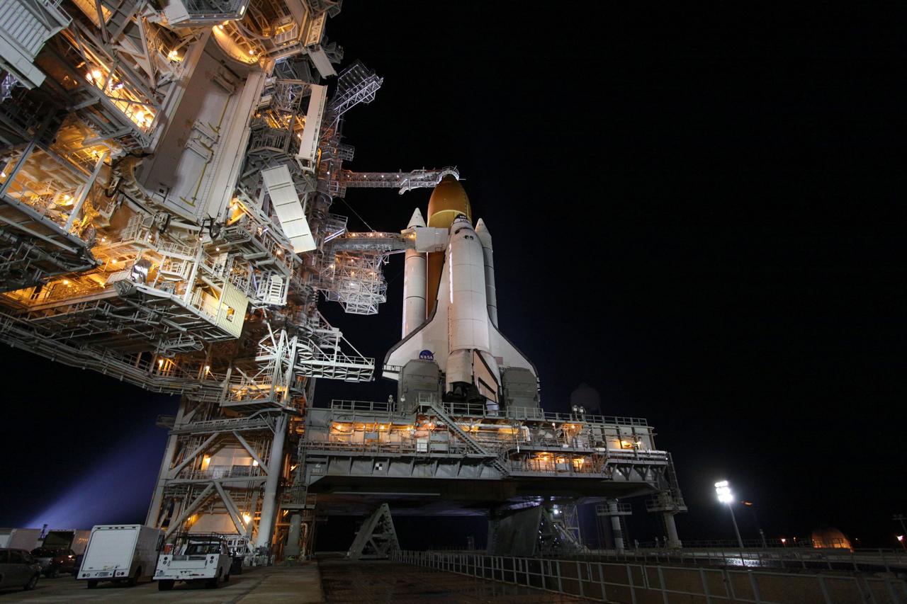 CAPE CANAVERAL, Fla. -- At NASA's Kennedy Space Center in Florida, space shuttle Endeavour is illuminated by bright xenon lights on Launch Pad 39A after the rotating service structure (RSS) was moved away. The structure provides weather protection and access to the shuttle while it awaits lift off on the pad. RSS "rollback," as it's called, began at 11:52 p.m. EDT on April 28. The move was scheduled to begin at 7 p.m., but storms over Kennedy delayed pad operations for a few hours. STS-134 will deliver the Express Logistics Carrier-3, Alpha Magnetic Spectrometer-2 (AMS), a high-pressure gas tank and additional spare parts for the Dextre robotic helper to the International Space Station. Endeavour was scheduled to launch at 3:47 p.m. on April 29, but that attempt was scrubbed for at least 72 hours while engineers assess an issue associated with the shuttle's Auxiliary Power Unit 1. STS-134 will be the final spaceflight for Endeavour. For more information visit, www.nasa.gov/mission_pages/shuttle/shuttlemissions/sts134/index.html. Photo credit: NASA/Ken Thornsley
