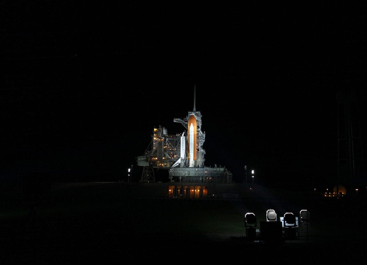 CAPE CANAVERAL, Fla. - At NASA's Kennedy Space Center in Florida, space shuttle Endeavour is illuminated by bright xenon lights on Launch Pad 39A after the rotating service structure (RSS) was moved away. The structure provides weather protection and access to the shuttle while it awaits lift off on the pad. RSS "rollback," as it's called, began at 11:52 p.m. EDT on April 28. The move was scheduled to begin at 7 p.m., but storms over Kennedy delayed pad operations for a few hours. STS-134 will deliver the Express Logistics Carrier-3, Alpha Magnetic Spectrometer-2 (AMS), a high-pressure gas tank and additional spare parts for the Dextre robotic helper to the International Space Station. Endeavour was scheduled to launch at 3:47 p.m. on April 29, but that attempt was scrubbed for at least 72 hours while engineers assess an issue associated with the shuttle's Auxiliary Power Unit 1. STS-134 will be the final spaceflight for Endeavour. For more information visit, www.nasa.gov/mission_pages/shuttle/shuttlemissions/sts134/index.html. Photo credit: NASA/Ken Thornsley