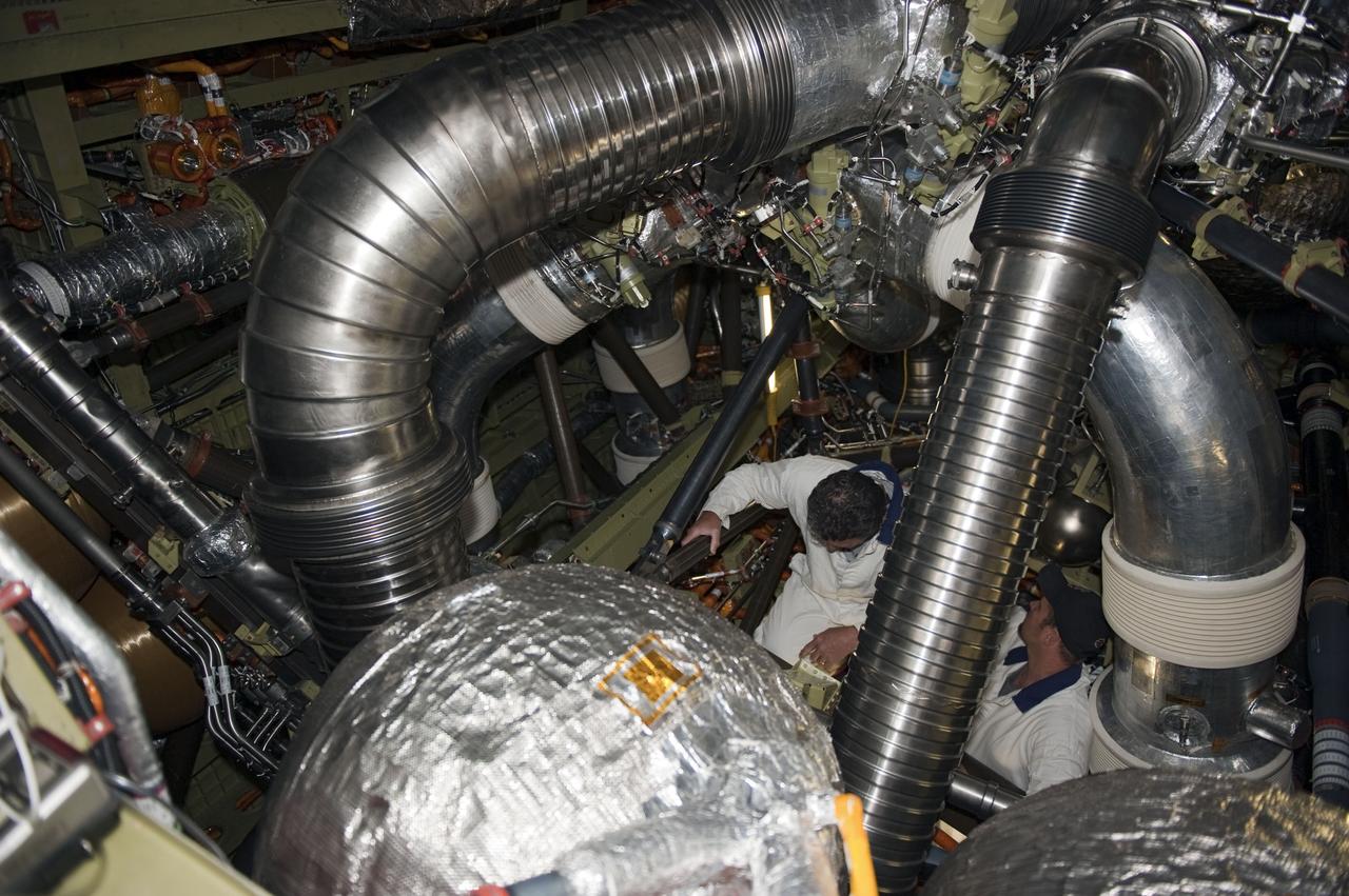 CAPE CANAVERAL, Fla. -- At NASA Kennedy Space Center's Launch Pad 39A, workers inside space shuttle Endeavour's aft section help prepare for the upcoming removal and replacement of the aft load control assembly-2 (ALCA-2). Located in the orbiter's aft avionics bay 5, the assembly is believed to have caused heaters on a fuel line for Endeavour's auxiliary power unit-1 (APU-1) to fail April 29 during the first launch attempt for the STS-134 mission. STS-134 will deliver the Express Logistics Carrier-3, Alpha Magnetic Spectrometer-2 (AMS), a high-pressure gas tank and additional spare parts for the Dextre robotic helper to the International Space Station. The mission also will be the final spaceflight for Endeavour. For more information, visit www.nasa.gov/mission_pages/shuttle/shuttlemissions/sts134/index.html. Photo credit: NASA/Kim Shiflett