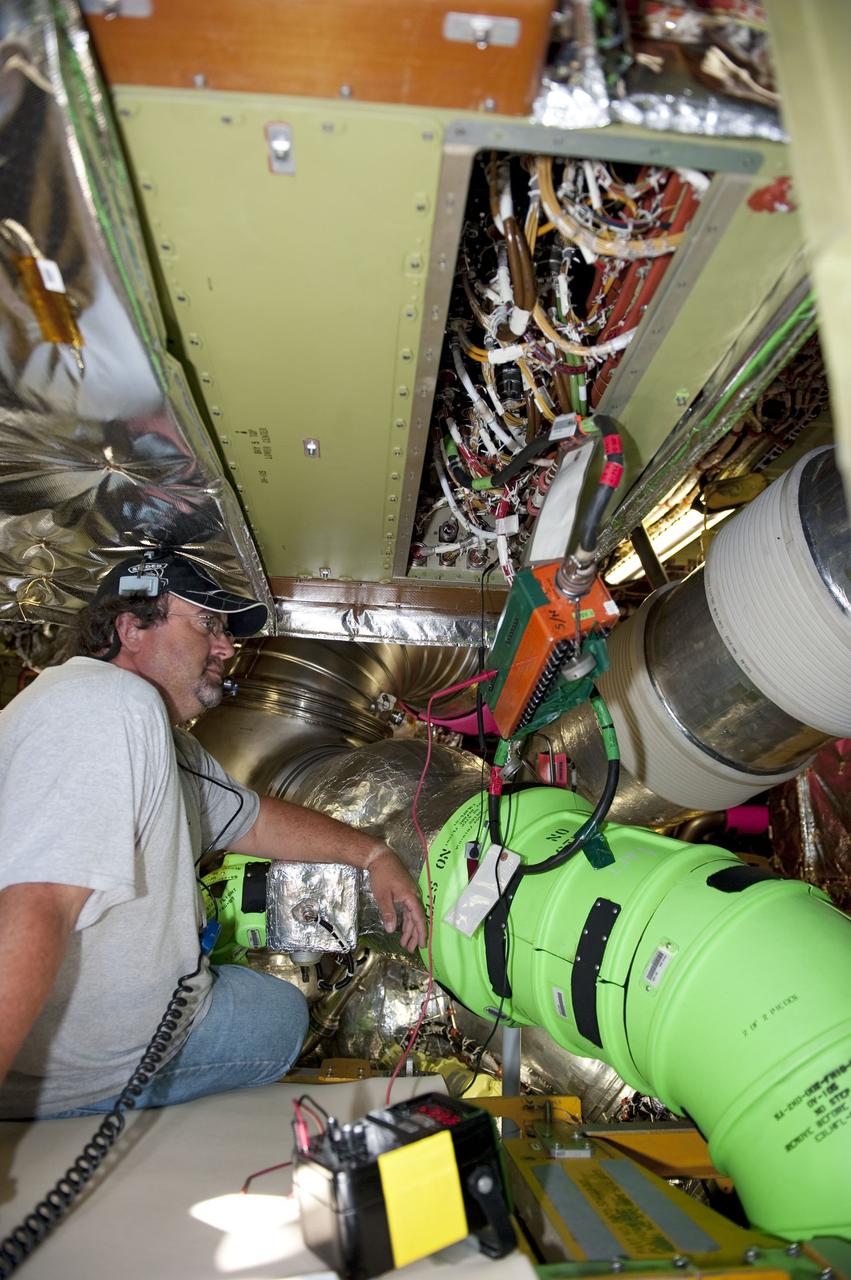 CAPE CANAVERAL, Fla. -- At NASA Kennedy Space Center's Launch Pad 39A, technicians inside space shuttle Endeavour's aft section test the Load Control Assembly-2 (LCA-2).      Located in the orbiter's aft avionics bay 5, the LCA-2 assembly, which feeds power to the fuel line heaters, is believed to have caused the heaters for Endeavour's auxiliary power unit-1 (APU-1) to fail April 29 during the first launch attempt for the STS-134 mission. STS-134 will deliver the Express Logistics Carrier-3, Alpha Magnetic Spectrometer-2 (AMS), a high-pressure gas tank and additional spare parts for the Dextre robotic helper to the International Space Station. The mission also will be the final spaceflight for Endeavour. For more information, visit www.nasa.gov/mission_pages/shuttle/shuttlemissions/sts134/index.html. Photo credit: NASA/Kim Shiflett.