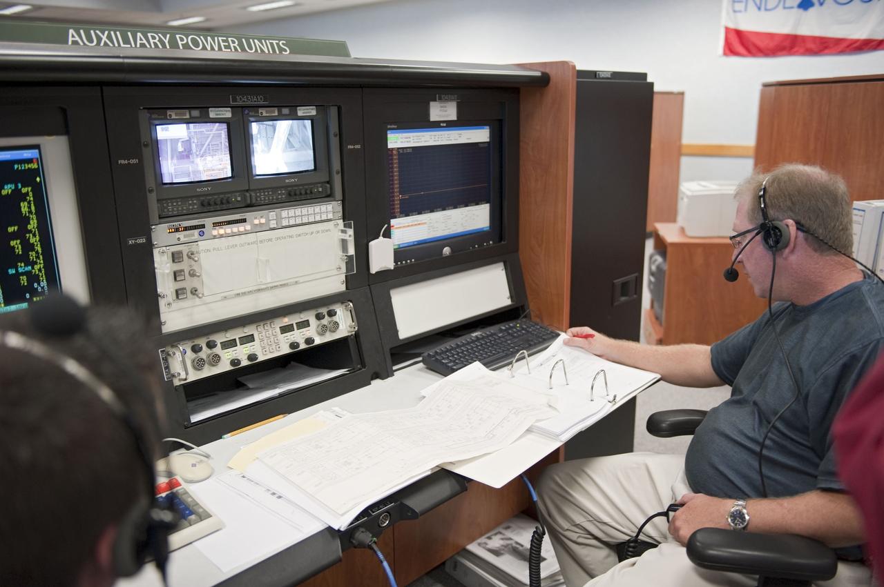 CAPE CANAVERAL, Fla. -- At NASA Kennedy Space Center's Launch Control Center, teams monitor the testing of the Load Control Assembly-2 (LCA-2) located in space shuttle Endeavour's aft section.    Located in the orbiter's aft avionics bay 5, the LCA-2 assembly, which feeds power to the fuel line heaters, is believed to have caused the heaters for Endeavour's auxiliary power unit-1 (APU-1) to fail April 29 during the first launch attempt for the STS-134 mission. STS-134 will deliver the Express Logistics Carrier-3, Alpha Magnetic Spectrometer-2 (AMS), a high-pressure gas tank and additional spare parts for the Dextre robotic helper to the International Space Station. The mission also will be the final spaceflight for Endeavour. For more information, visit www.nasa.gov/mission_pages/shuttle/shuttlemissions/sts134/index.html. Photo credit: NASA/Kim Shiflett.