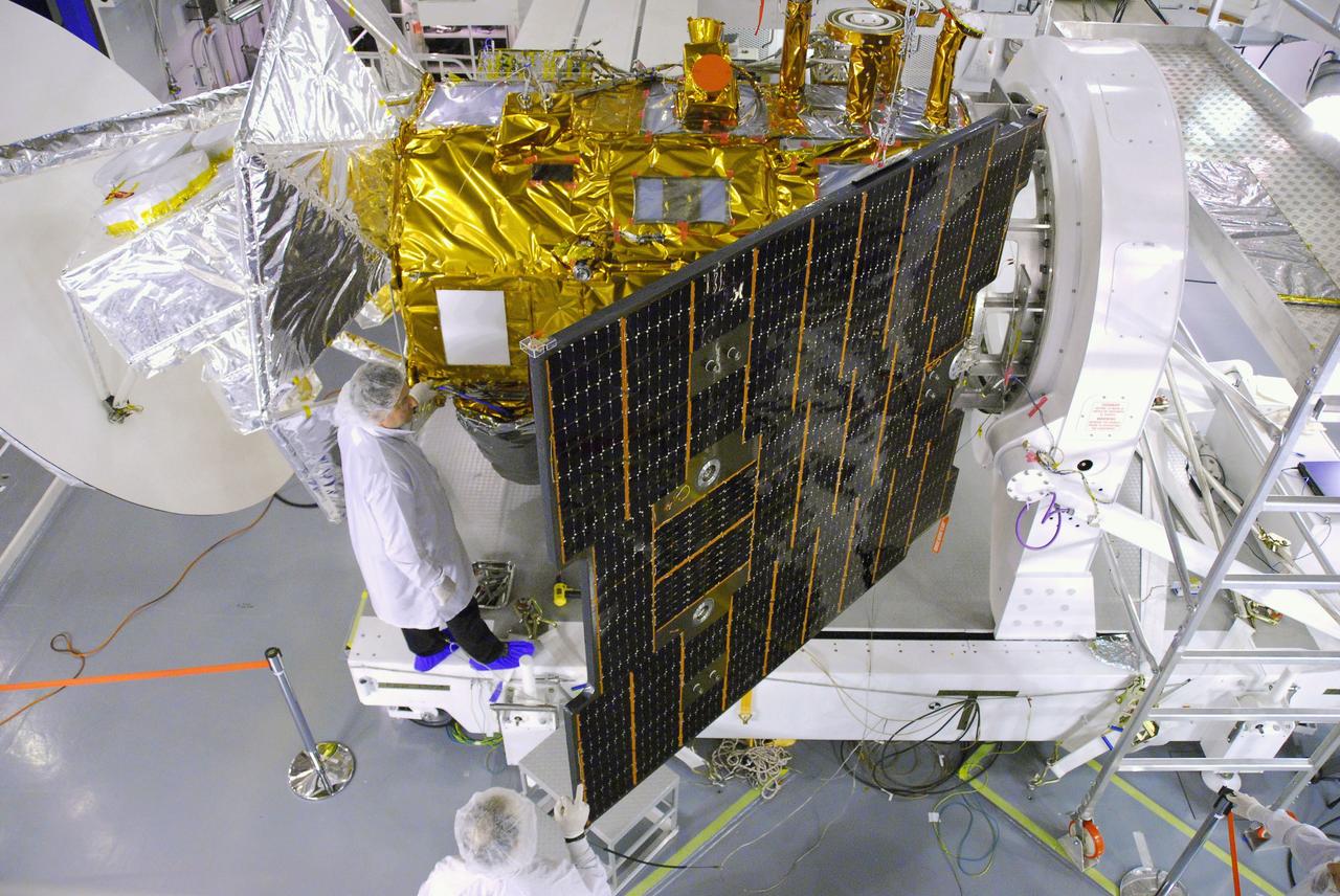 VANDENBERG AIR FORCE BASE, Calif. -- In Space Systems International's Payload Processing Facility at Vandenberg Air Force Base in California, technicians prepare to close the solar arrays on the Aquarius/SAC-D spacecraft.     Following final tests, the spacecraft will be integrated to a United Launch Alliance Delta II rocket in preparation for the targeted June launch. Aquarius, the NASA-built primary instrument on the SAC-D spacecraft, will provide new insights into how variations in ocean surface salinity relate to fundamental climate processes on its three-year mission. Photo credit: NASA/VAFB