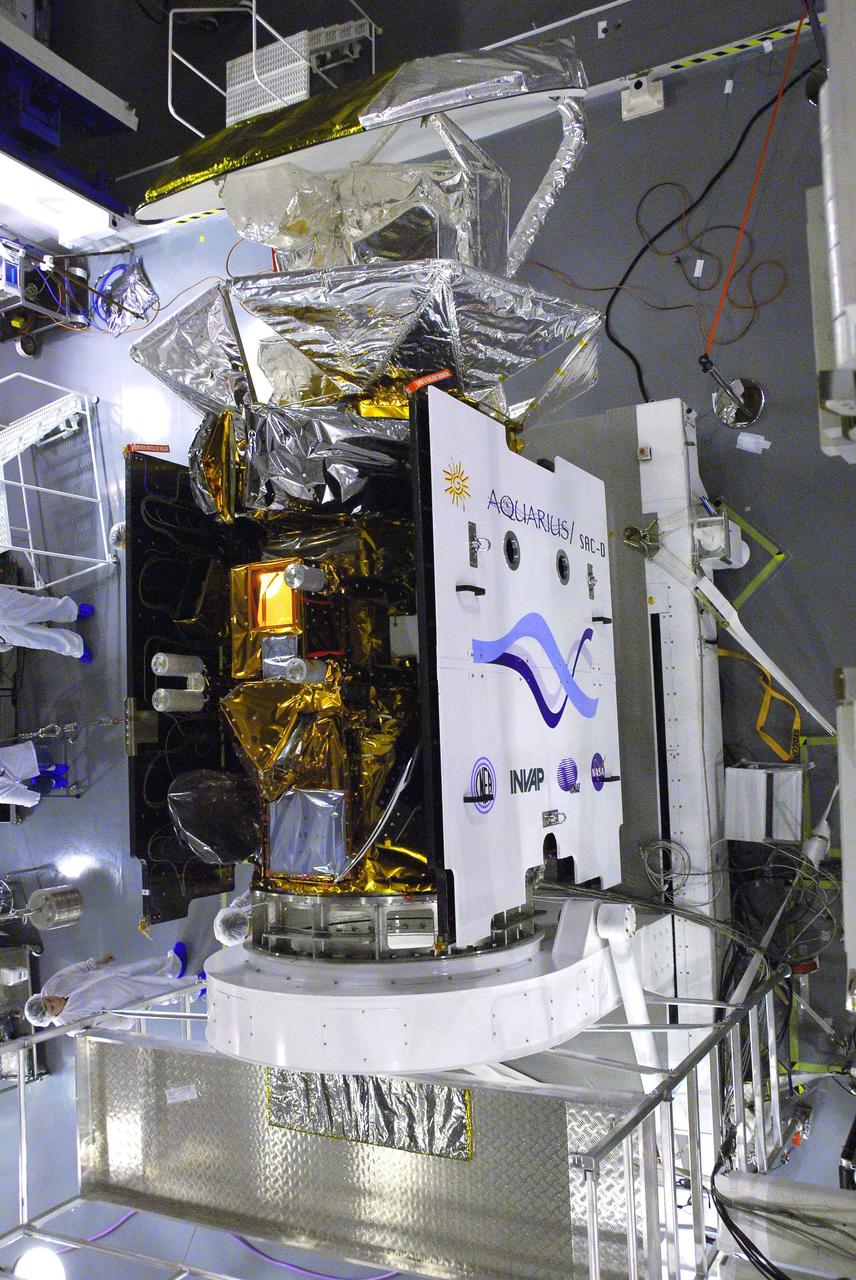VANDENBERG AIR FORCE BASE, Calif. -- In Space Systems International's Payload Processing Facility at Vandenberg Air Force Base in California, technicians prepare to test the solar array after it was integrated to the Aquarius/SAC-D spacecraft.   Following final tests, the spacecraft will be integrated to a United Launch Alliance Delta II rocket in preparation for the targeted June launch. Aquarius, the NASA-built primary instrument on the SAC-D spacecraft, will provide new insights into how variations in ocean surface salinity relate to fundamental climate processes on its three-year mission. Photo credit: NASA/VAFB