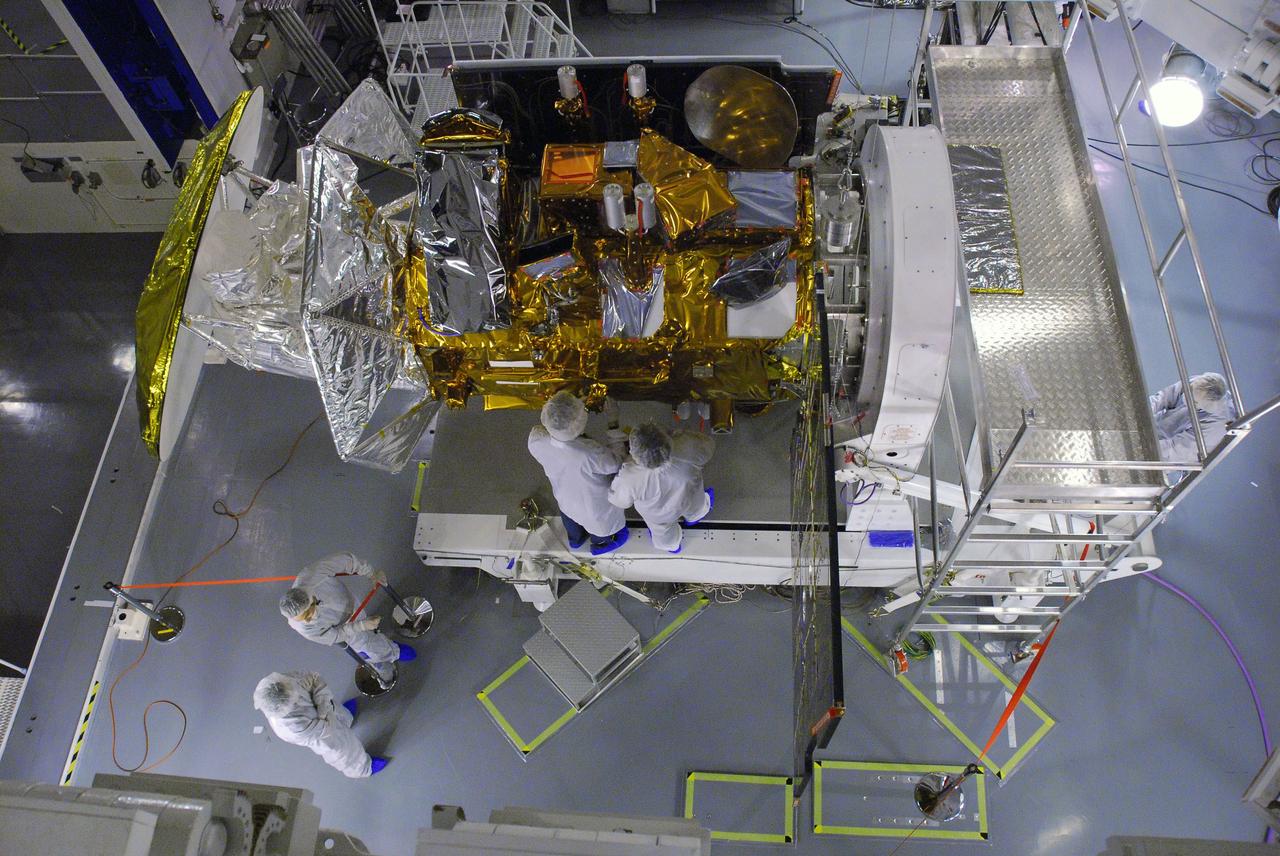 VANDENBERG AIR FORCE BASE, Calif. -- In Space Systems International's Payload Processing Facility at Vandenberg Air Force Base in California, technicians perform blanket work in the vicinity of the dual-thruster modules  on the Aquarius/SAC-D spacecraft.  Following final tests, the spacecraft will be integrated to a United Launch Alliance Delta II rocket in preparation for the targeted June launch. Aquarius, the NASA-built primary instrument on the SAC-D spacecraft, will provide new insights into how variations in ocean surface salinity relate to fundamental climate processes on its three-year mission. Photo credit: NASA/VAFB