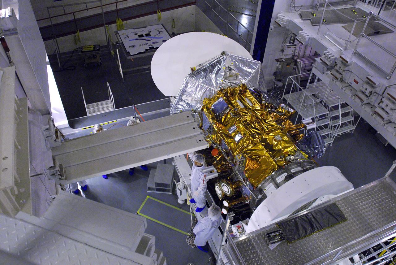 VANDENBERG AIR FORCE BASE, Calif. --In Space Systems International's Payload Processing Facility at Vandenberg Air Force Base in California, technicians have suspended a platform over the Aquarius/SAC-D spacecraft to allow access for the installation of the second solar array.   Following final tests, the spacecraft will be integrated to a United Launch Alliance Delta II rocket in preparation for the targeted June launch. Aquarius, the NASA-built primary instrument on the SAC-D spacecraft, will provide new insights into how variations in ocean surface salinity relate to fundamental climate processes on its three-year mission. Photo credit: NASA/VAFB