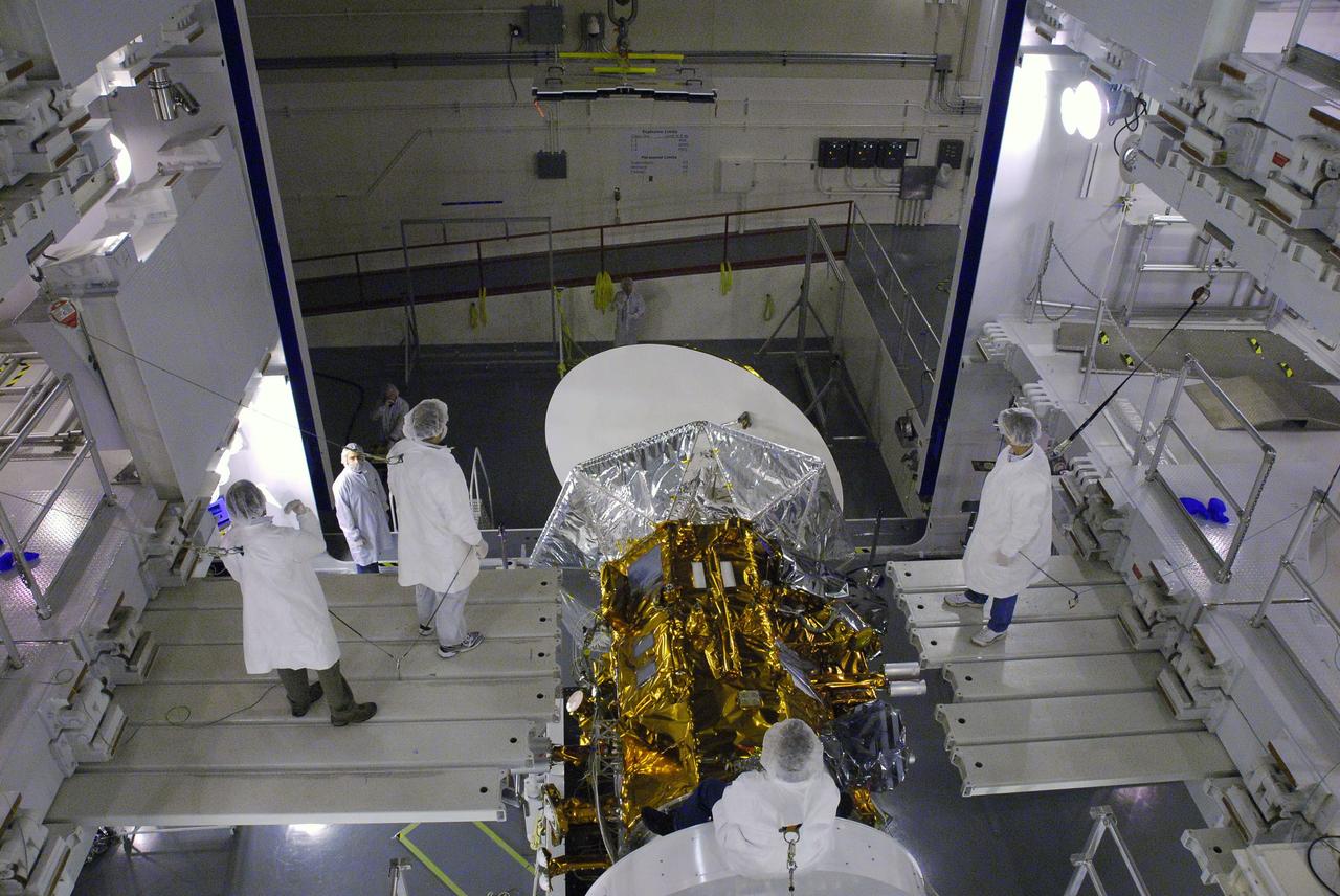 VANDENBERG AIR FORCE BASE, Calif. -- In Space Systems International's Payload Processing Facility at Vandenberg Air Force Base in California, technicians on suspended platforms are preparing to install the second solar array to the Aquarius/SAC-D spacecraft.  Following final tests, the spacecraft will be integrated to a United Launch Alliance Delta II rocket in preparation for the targeted June launch. Aquarius, the NASA-built primary instrument on the SAC-D spacecraft, will provide new insights into how variations in ocean surface salinity relate to fundamental climate processes on its three-year mission. Photo credit: NASA/VAFB