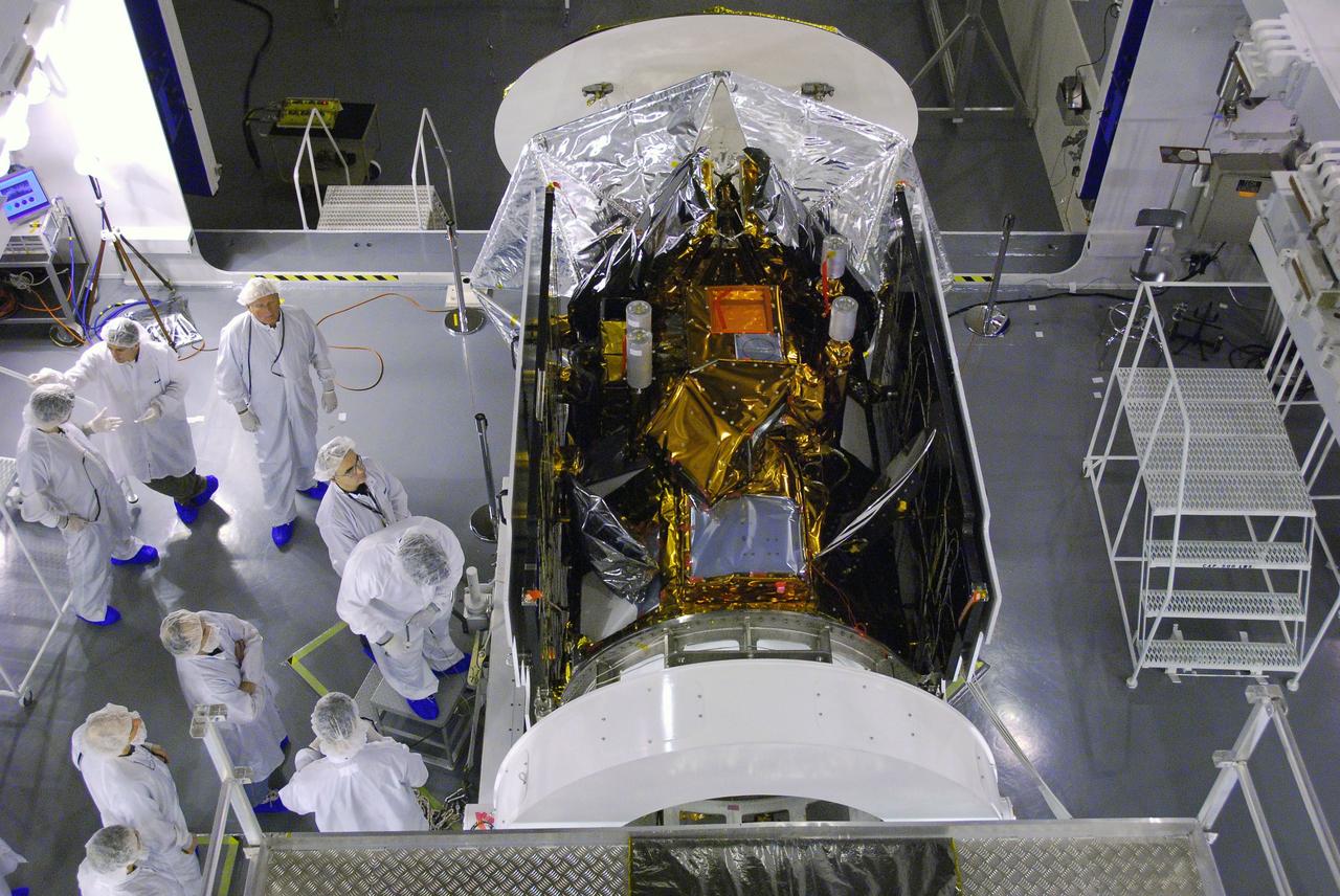 VANDENBERG AIR FORCE BASE, Calif. --In Space Systems International's Payload Processing Facility at Vandenberg Air Force Base in California, technicians prepare to test the second solar array after integration to the Aquarius/SAC-D spacecraft.  Following final tests, the spacecraft will be integrated to a United Launch Alliance Delta II rocket in preparation for the targeted June launch. Aquarius, the NASA-built primary instrument on the SAC-D spacecraft, will provide new insights into how variations in ocean surface salinity relate to fundamental climate processes on its three-year mission. Photo credit: NASA/VAFB