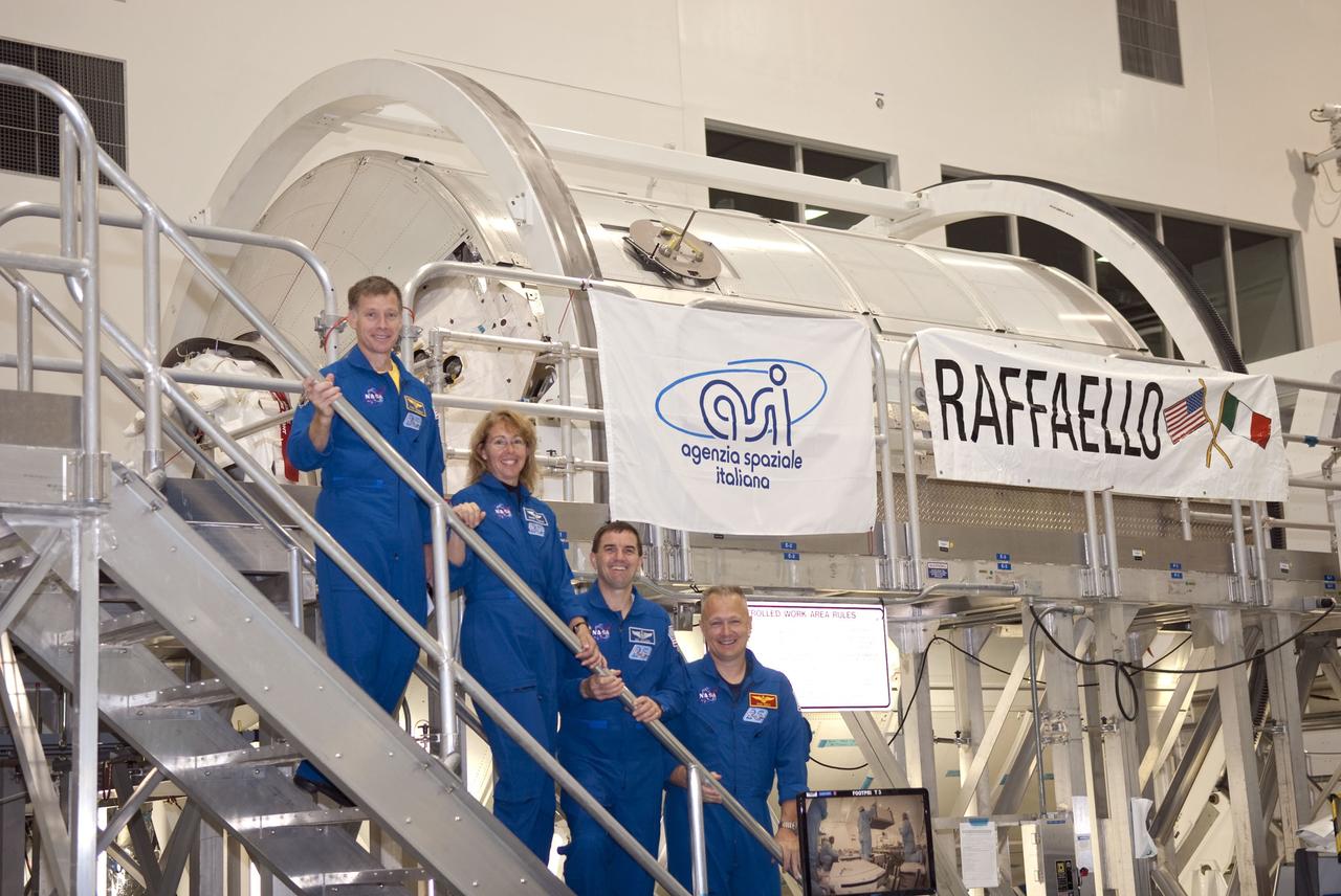 CAPE CANAVERAL, Fla. -- Space shuttle Atlantis' STS-135 crew participates in a crew equipment interface test, or CEIT, in the Space Station Processing Facility at NASA's Kennedy Space Center in Florida. The purpose of CEIT is for flight crew members to become familiar with the hardware and tools they will work with in space. Standing in front of the Raffaello multi-purpose logistics module, which will be packed with supplies, logistics and spare parts for their mission to the International Space Station, are, from left, Commander Chris Ferguson, Mission Specialists Sandy Magnus and Rex Walheim, and Pilot Doug Hurley. STS-135 also will return a failed ammonia pump module on the Lightweight Multi-Purpose Experiment Support Structure Carrier, or LMC, to help NASA better understand the failure mechanism and improve pump designs for future systems.              STS-135, targeted to launch June 28, will be the 33rd flight of Atlantis, the 37th shuttle mission to the space station, and the 135th and final mission of NASA's Space Shuttle Program. For more information visit, www.nasa.gov/mission_pages/shuttle/shuttlemissions/sts135/index.html. Photo credit: NASA/Jim Grossmann