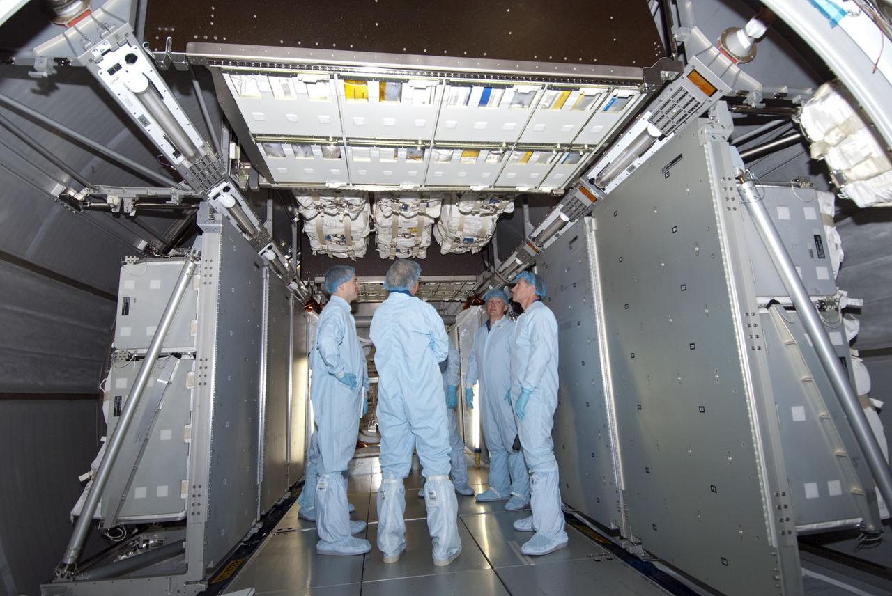 CAPE CANAVERAL, Fla. -- Space shuttle Atlantis' STS-135 crew participates in a crew equipment interface test, or CEIT, in the Space Station Processing Facility at NASA's Kennedy Space Center in Florida. The purpose of CEIT is for flight crew members to become familiar with the hardware and tools they will work with in space. Here, the four-member crew and technicians perform a walk down in the Raffaello multi-purpose logistics module, which will be packed with supplies, logistics and spare parts, bound for the International Space Station. STS-135 also will return a failed ammonia pump module on the Lightweight Multi-Purpose Experiment Support Structure Carrier, or LMC, to help NASA better understand the failure mechanism and improve pump designs for future systems.        STS-135, targeted to launch June 28, will be the 33rd flight of Atlantis, the 37th shuttle mission to the space station, and the 135th and final mission of NASA's Space Shuttle Program. For more information visit, www.nasa.gov/mission_pages/shuttle/shuttlemissions/sts135/index.html. Photo credit: NASA/Jim Grossmann