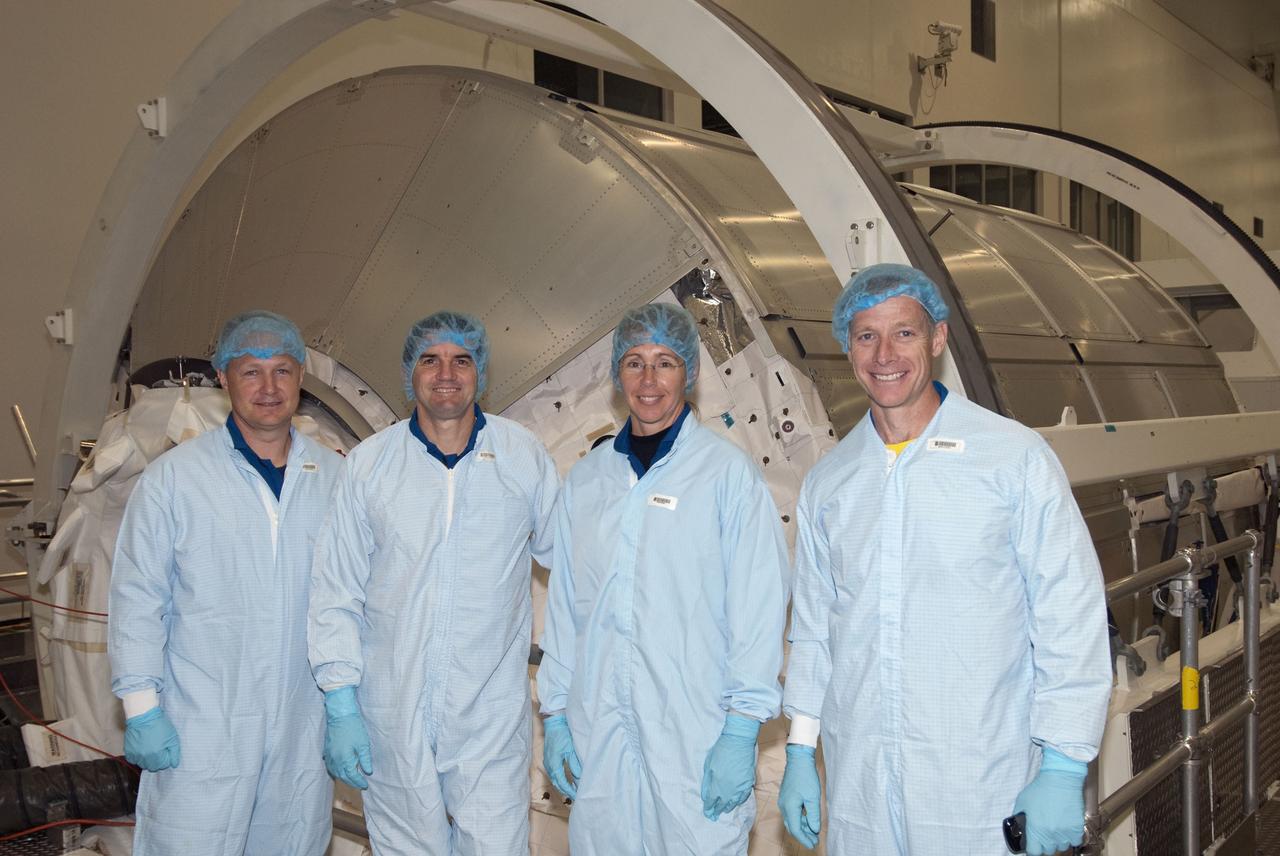 CAPE CANAVERAL, Fla. -- Space shuttle Atlantis' STS-135 crew participates in a crew equipment interface test, or CEIT, in the Space Station Processing Facility at NASA's Kennedy Space Center in Florida. The purpose of CEIT is for flight crew members to become familiar with the hardware and tools they will work with in space. Standing in front of the Raffaello multi-purpose logistics module, which will be packed with supplies, logistics and spare parts for their mission to the International Space Station, are, from left, Pilot Doug Hurley, Mission Specialists Rex Walheim and Sandy Magnus, and Commander Chris Ferguson. STS-135 also will return a failed ammonia pump module on the Lightweight Multi-Purpose Experiment Support Structure Carrier, or LMC, to help NASA better understand the failure mechanism and improve pump designs for future systems.      STS-135, targeted to launch June 28, will be the 33rd flight of Atlantis, the 37th shuttle mission to the space station, and the 135th and final mission of NASA's Space Shuttle Program. For more information visit, www.nasa.gov/mission_pages/shuttle/shuttlemissions/sts135/index.html. Photo credit: NASA/Jim Grossmann