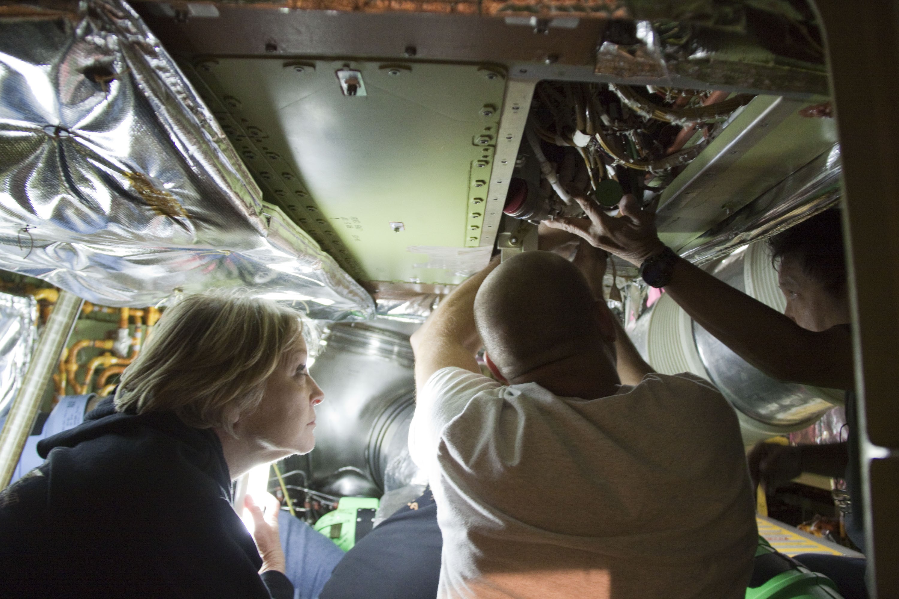 CAPE CANAVERAL, Fla. -- At NASA Kennedy Space Center's Launch Pad 39A, technicians begin to remove the Load Control Assembly-2 (LCA-2) from inside space shuttle Endeavour's aft section. Located in the orbiter's aft avionics bay 5, the LCA-2 assembly, which feeds power to the fuel line heaters, is believed to have caused the heaters for Endeavour's auxiliary power unit-1 (APU-1) to fail April 29 during the first launch attempt for the STS-134 mission. The assembly will be replaced and systems will be retested before the launch is rescheduled.          STS-134 will deliver the Express Logistics Carrier-3, Alpha Magnetic Spectrometer-2 (AMS), a high-pressure gas tank and additional spare parts for the Dextre robotic helper to the International Space Station. The mission also will be the final spaceflight for Endeavour. For more information, visit www.nasa.gov/mission_pages/shuttle/shuttlemissions/sts134/index.html. Photo credit: NASA/Troy Cryder