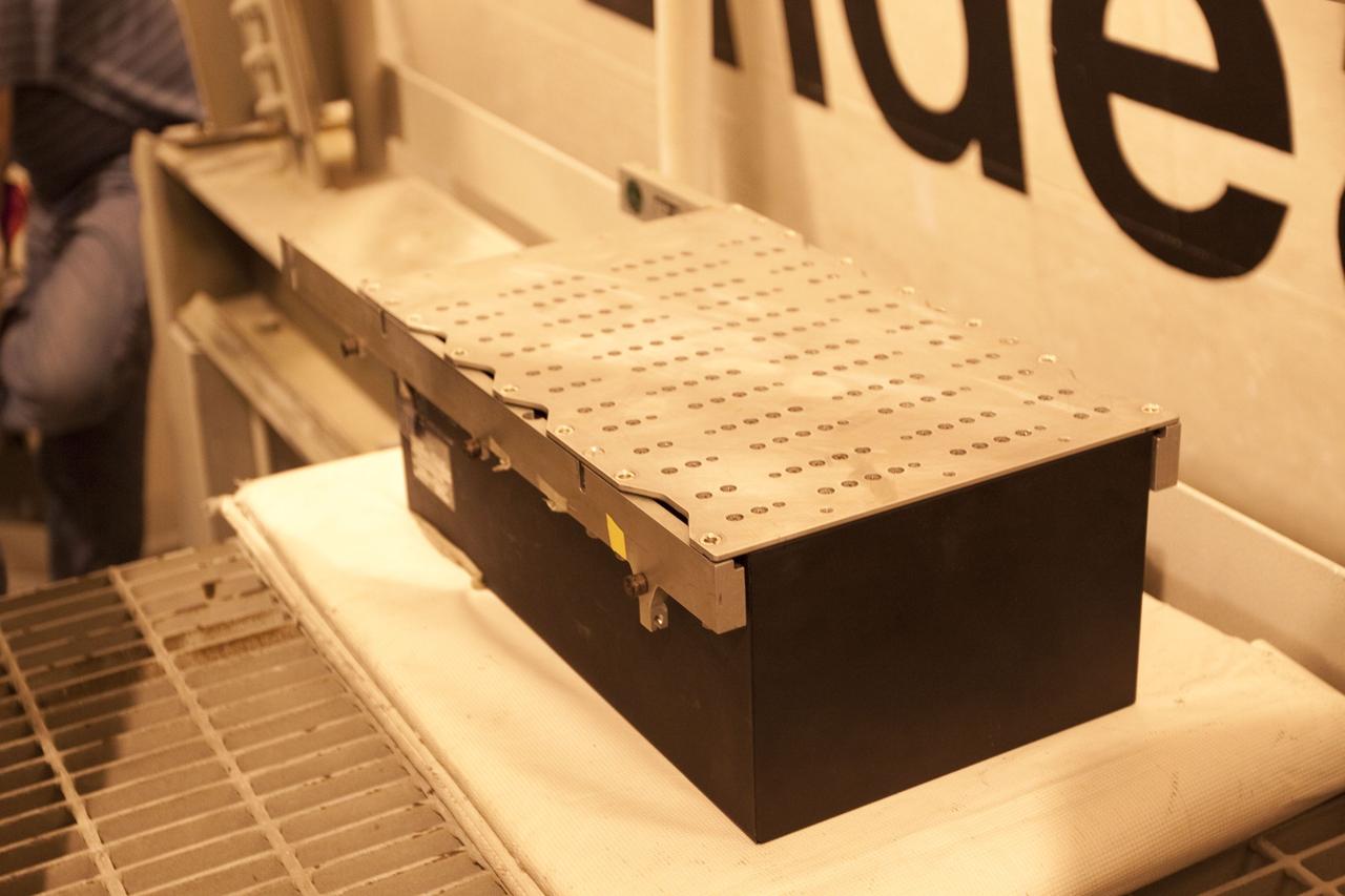 CAPE CANAVERAL, Fla. -- The Load Control Assembly-2 (LCA-2) is outside at NASA Kennedy Space Center's Launch Pad 39A after it was removed from inside space shuttle Endeavour's aft section. Located in the orbiter's aft avionics bay 5, the LCA-2 assembly, which feeds power to the fuel line heaters, is believed to have caused the heaters for Endeavour's auxiliary power unit-1 (APU-1) to fail April 29 during the first launch attempt for the STS-134 mission. The assembly will be replaced and systems will be retested before the launch is rescheduled.        STS-134 will deliver the Express Logistics Carrier-3, Alpha Magnetic Spectrometer-2 (AMS), a high-pressure gas tank and additional spare parts for the Dextre robotic helper to the International Space Station. The mission also will be the final spaceflight for Endeavour. For more information, visit www.nasa.gov/mission_pages/shuttle/shuttlemissions/sts134/index.html. Photo credit: NASA/Troy Cryder