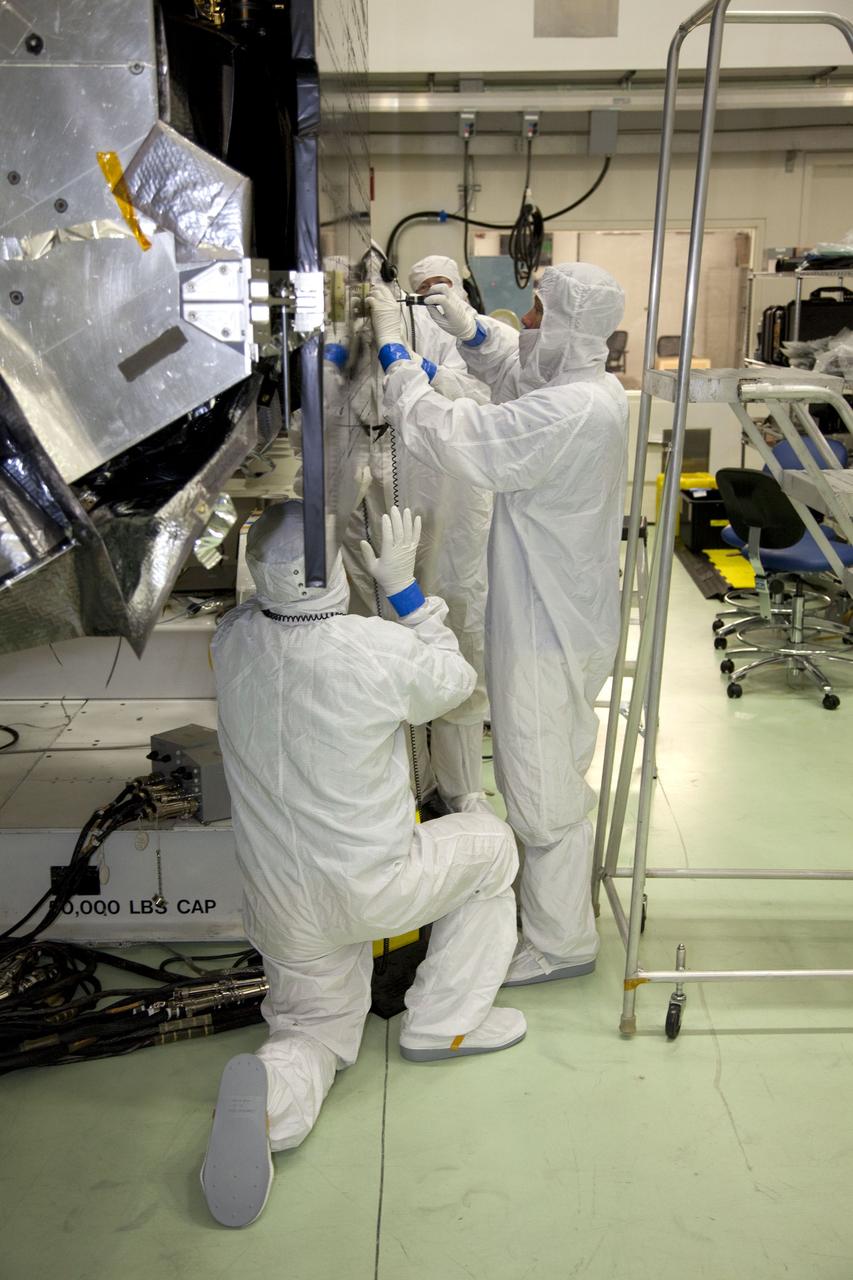 TITUSVILLE, Fla. -- Lockheed Martin technicians in the Astrotech payload processing facility in Titusville, Fla., install the Radio and Plasma Wave Sensor, called WAVES for short, on to NASA's Juno spacecraft. WAVES is a science boom instrument that will measure radio and plasma waves emitting from Jupiter. Juno is scheduled to launch aboard an Atlas V rocket from Cape Canaveral, Fla., on Aug. 5, 2011, reaching Jupiter in July 2016. The spacecraft will orbit the giant planet more than 30 times, skimming to within 3,000 miles above its cloud tops, for about one year. With its suite of science instruments, the spacecraft will investigate the existence of a solid planetary core, map Jupiter's intense magnetic field, measure the amount of water and ammonia in the deep atmosphere, and observe the planet's auroras. For more information visit, www.nasa.gov/mission_pages/juno. Photo credit: NASA/Frankie Martin