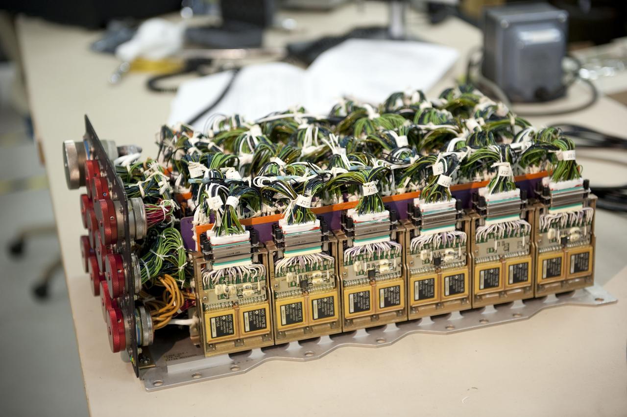 CAPE CANAVERAL, Fla. -- At the NASA Shuttle Logistics Depot in Cape Canaveral, Florida, the Load Control Assembly-2 (LCA-2) is uncovered for testing.      Located in space shuttle Endeavour's aft avionics bay 5, the LCA-2, which distributes power to nine shuttle systems, is believed to have caused fuel line heaters for Endeavour's auxiliary power unit-1 (APU-1) to fail April 29 during the first launch attempt for the STS-134 mission. The LCA-2 will be replaced and systems will be retested before the launch is rescheduled. STS-134 will deliver the Express Logistics Carrier-3, Alpha Magnetic Spectrometer-2 (AMS), a high-pressure gas tank and additional spare parts for the Dextre robotic helper to the International Space Station. The mission also will be the final spaceflight for Endeavour. For more information, visit www.nasa.gov/mission_pages/shuttle/shuttlemissions/sts134/index.html. Photo credit: NASA/Kim Shiflett