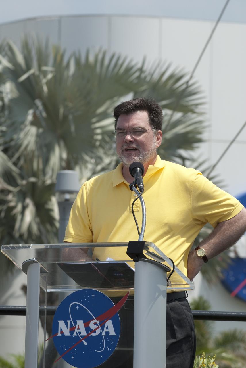 CAPE CANAVERAL, Fla. -- In the Rocket Garden at NASA's Kennedy Space Center Visitor Complex in Florida, NASA's Deputy Director for Planetary Science, Jim Adams speaks to the audience in attendance for the United States Postal Service unveiling of two new stamps that commemorates the 50th anniversary of human spaceflight.    One stamp commemorates NASA's Project Mercury and Alan Shepard's historic launch on May 5, 1961, aboard the spacecraft Freedom 7. The second stamp honors NASA's MESSENGER, which reached Mercury in March to become the first spacecraft to orbit the planet. The two missions frame a remarkable 50-year period in which America advanced space exploration through more than 1,500 crewed and uncrewed flights. Photo credit: NASA/Kim Shiflett