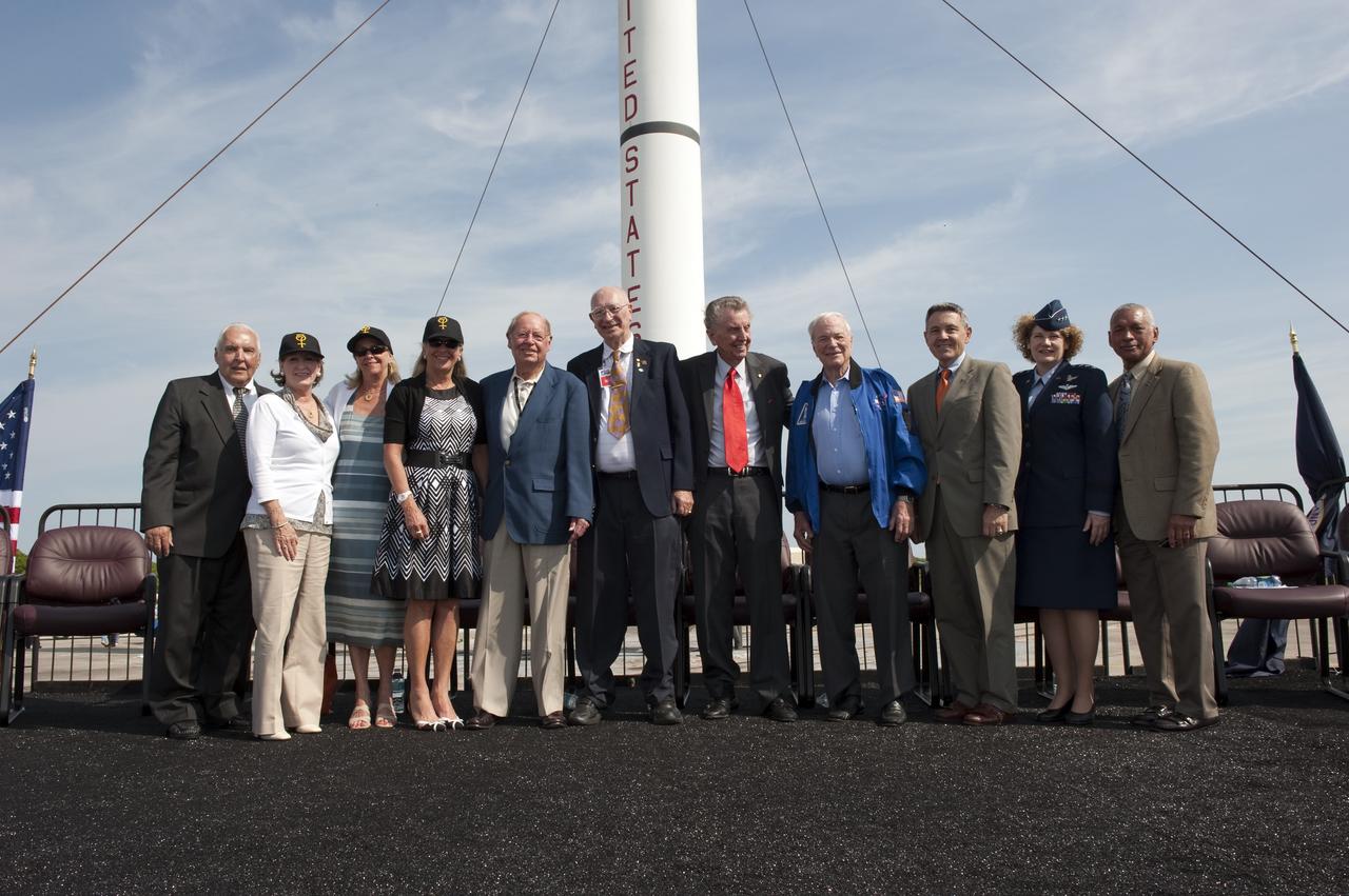 CAPE CANAVERAL, Fla. -- Program participants pose for a group photo in front of a replica of a Mercury-Redstone rocket during a celebration at Complex 5/6 on Cape Canaveral Air Force Station in Florida.  From left are Hugh Harris, former director of Public Affairs at Kennedy Space Center; Alice Wackermann, Julie Jenkins and Laura Churchley, daughters of astronaut Alan Shepard; Jack King, former chief, Public Information Office, Marshall Space Flight Center; Bob Moser, former chief test conductor for the Mercury-Redstone launches; NBC reporter Jay Barbree; Mercury astronaut Scott Carpenter; Kennedy Space Center Director Bob Cabana; Lieutenant General Susan J. Helms, commander of the 14th Air Force and former astronaut; and NASA Administrator Charlie Bolden.    The celebration was held at the launch site of the first U.S. manned spaceflight May 5, 1961, to mark the 50th anniversary of the flight.  Fifty years ago, astronaut Alan Shepard lifted off inside the Mercury capsule, "Freedom 7," atop an 82-foot-tall Mercury-Redstone rocket at 9:34 a.m. EST, sending him on a remarkably successful, 15-minute suborbital flight. The event was attended by more than 200 workers from the original Mercury program and included a re-creation of Shepard's flight and recovery, as well as a tribute to his contributions as a moonwalker on the Apollo 14 lunar mission. For more information, visit www.nasa.gov/topics/history/milestones/index.html. Photo credit: NASA/Kim Shiflett