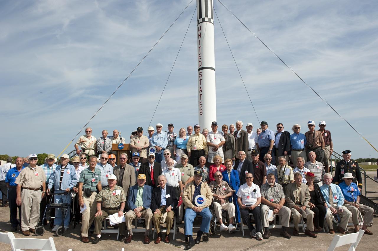 CAPE CANAVERAL, Fla. -- More than 200 workers from the original Mercury program pose for a group photo in front of a replica of a Mercury-Redstone rocket during a celebration at Complex 5/6 on Cape Canaveral Air Force Station in Florida.     The celebration was held at the launch site of the first U.S. manned spaceflight May 5, 1961, to mark the 50th anniversary of the flight.  Fifty years ago, astronaut Alan Shepard lifted off inside the Mercury capsule, "Freedom 7," atop an 82-foot-tall Mercury-Redstone rocket at 9:34 a.m. EST, sending him on a remarkably successful, 15-minute suborbital flight. The event was attended by more than 200 workers from the original Mercury program and included a re-creation of Shepard's flight and recovery, as well as a tribute to his contributions as a moonwalker on the Apollo 14 lunar mission. For more information, visit www.nasa.gov/topics/history/milestones/index.html. Photo credit: NASA/Kim Shiflett