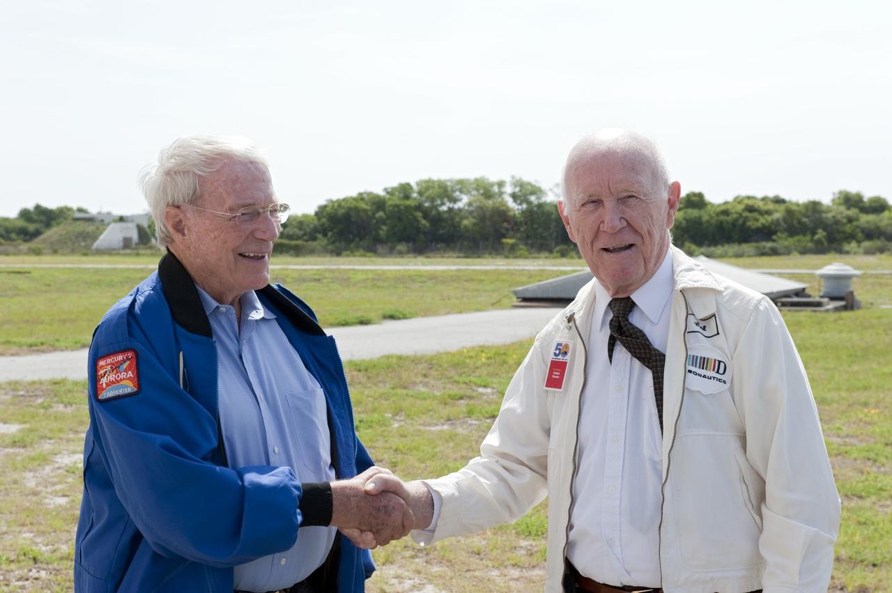 CAPE CANAVERAL, Fla. -- During a celebration at Complex 5/6 on Cape Canaveral Air Force Station in Florida, Mercury astronaut Scott Carpenter greets Calvin Fowler, the launch conductor for Carpenter's Mercury-Atlas 7 mission on May 24, 1962.     The celebration was held at the launch site of the first U.S. manned spaceflight May 5, 1961, to mark the 50th anniversary of the flight.  Fifty years ago, astronaut Alan Shepard lifted off inside the Mercury capsule, "Freedom 7," atop an 82-foot-tall Mercury-Redstone rocket at 9:34 a.m. EST, sending him on a remarkably successful, 15-minute suborbital flight. The event was attended by more than 200 workers from the original Mercury program and included a re-creation of Shepard's flight and recovery, as well as a tribute to his contributions as a moonwalker on the Apollo 14 lunar mission. For more information, visit www.nasa.gov/topics/history/milestones/index.html. Photo credit: NASA/Kim Shiflett