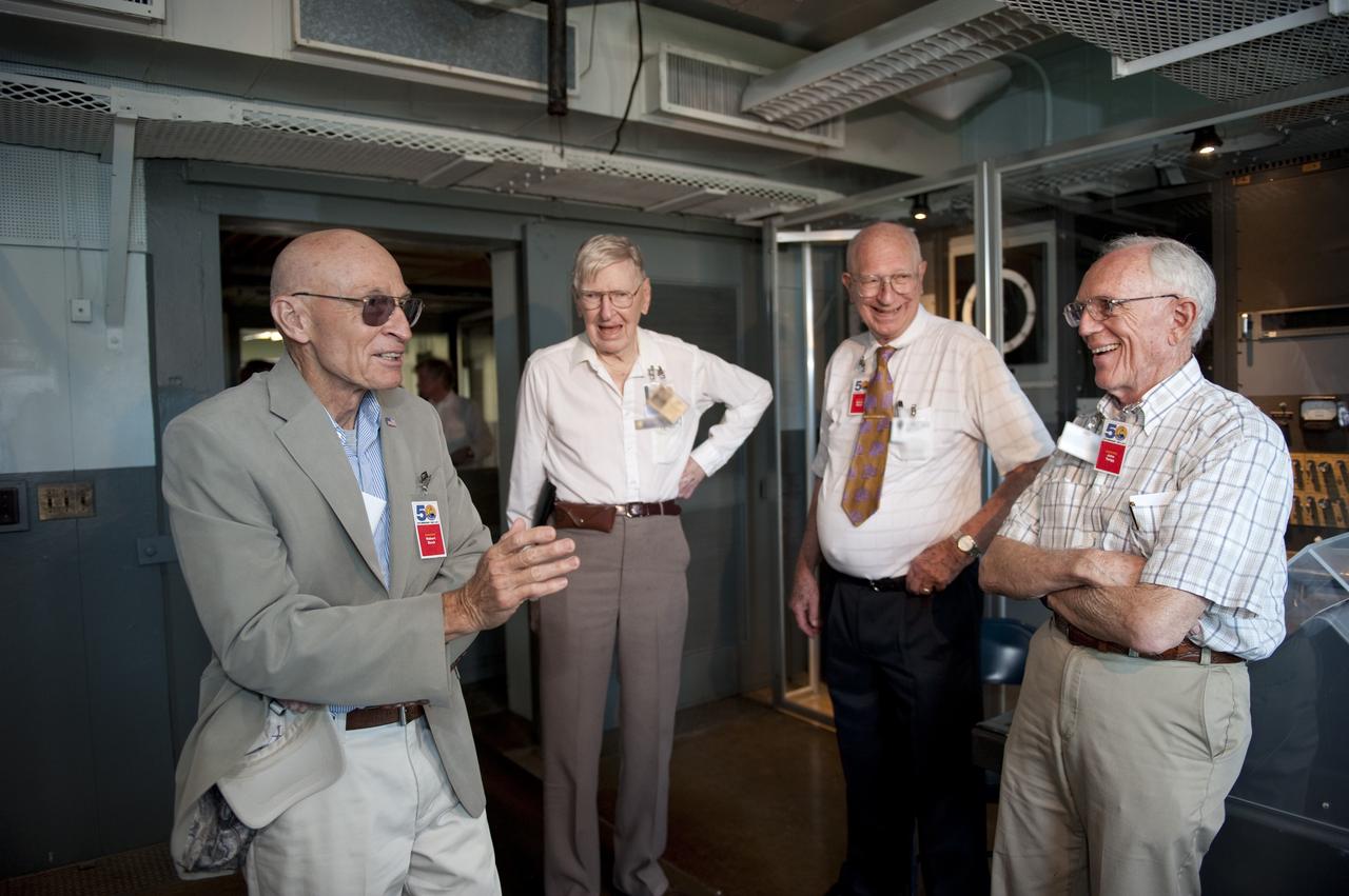 CAPE CANAVERAL, Fla. -- On Cape Canaveral Air Force Station in Florida, invited guests tour the blockhouse at Complex 5/6 during a celebration of Alan Shepard's historic flight 50 years ago. From left are Robert Sieck, former shuttle launch director; Andy Anderson, former manager for communications in the Mercury Mission Control Center; Bob Moser, former chief test conductor for the Mercury-Redstone launches; and John Twigg, former backup chief test conductor for the Mercury-Redstone launches.    The celebration was held at the launch site of the first U.S. manned spaceflight May 5, 1961, to mark the 50th anniversary of the flight.  Fifty years ago, astronaut Alan Shepard lifted off inside the Mercury capsule, "Freedom 7," atop an 82-foot-tall Mercury-Redstone rocket at 9:34 a.m. EST, sending him on a remarkably successful, 15-minute suborbital flight. The event was attended by more than 200 workers from the original Mercury program and included a re-creation of Shepard's flight and recovery, as well as a tribute to his contributions as a moonwalker on the Apollo 14 lunar mission. For more information, visit www.nasa.gov/topics/history/milestones/index.html. Photo credit: NASA/Kim Shiflett