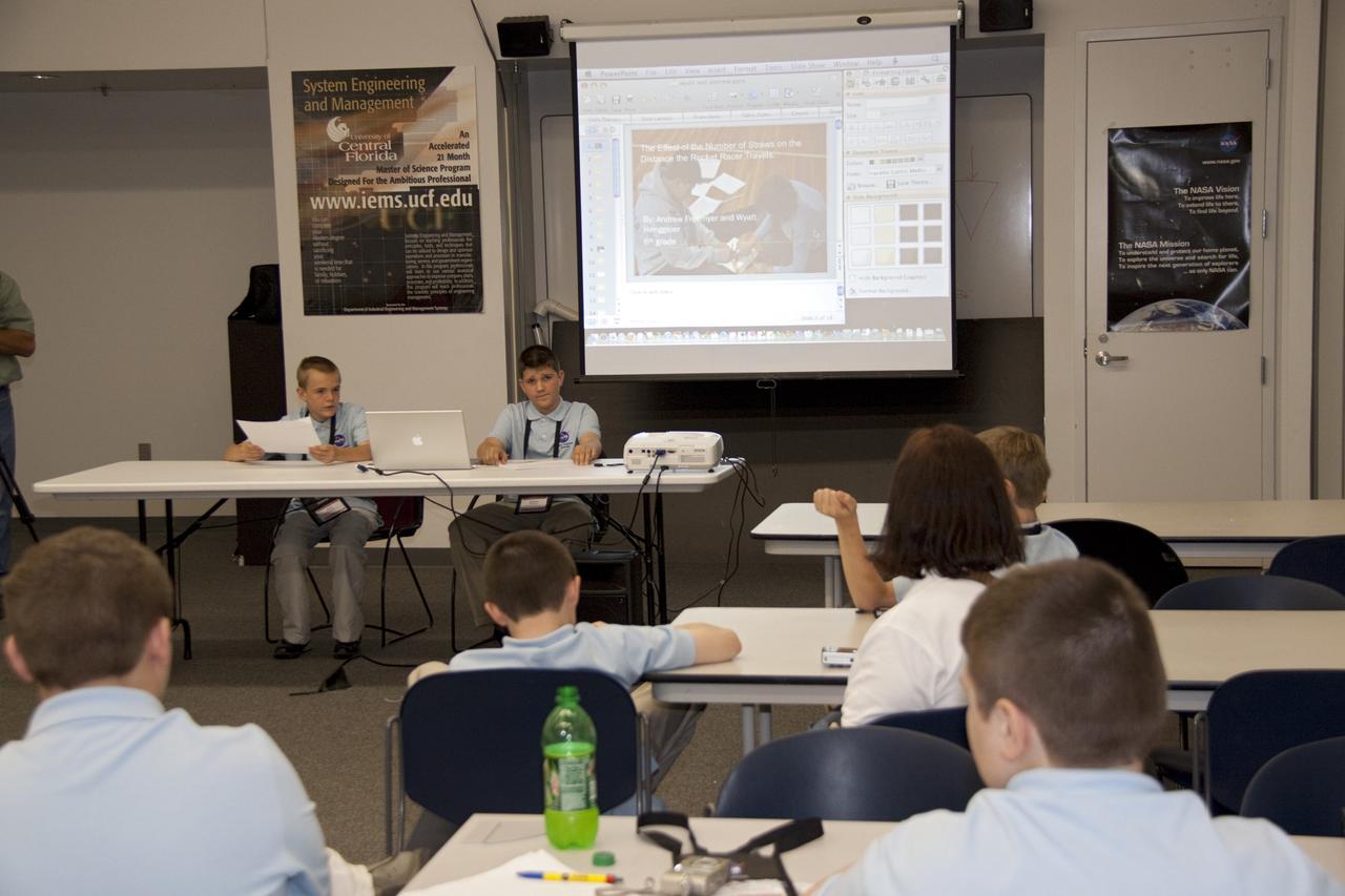 CAPE CANAVERAL, Fla. -- Students present their investigation project to their peers, scientists, engineers and education specialists during the NASA Explorer Schools Symposium at Kennedy Space Center in Florida. About 60 fourth- through 12-grade students from across the nation are at the center May 4-7 participating in tours of processing and launch facilities and the U.S. Astronaut Hall of Fame, as well as several educational activities and a career panel question-and-answer session. About 30 teachers will receive professional development opportunities during the symposium. The participants were competitively selected after they completed an original investigation focused on existing NASA missions or research interests. Photo Credit: NASA/Jack Pfaller