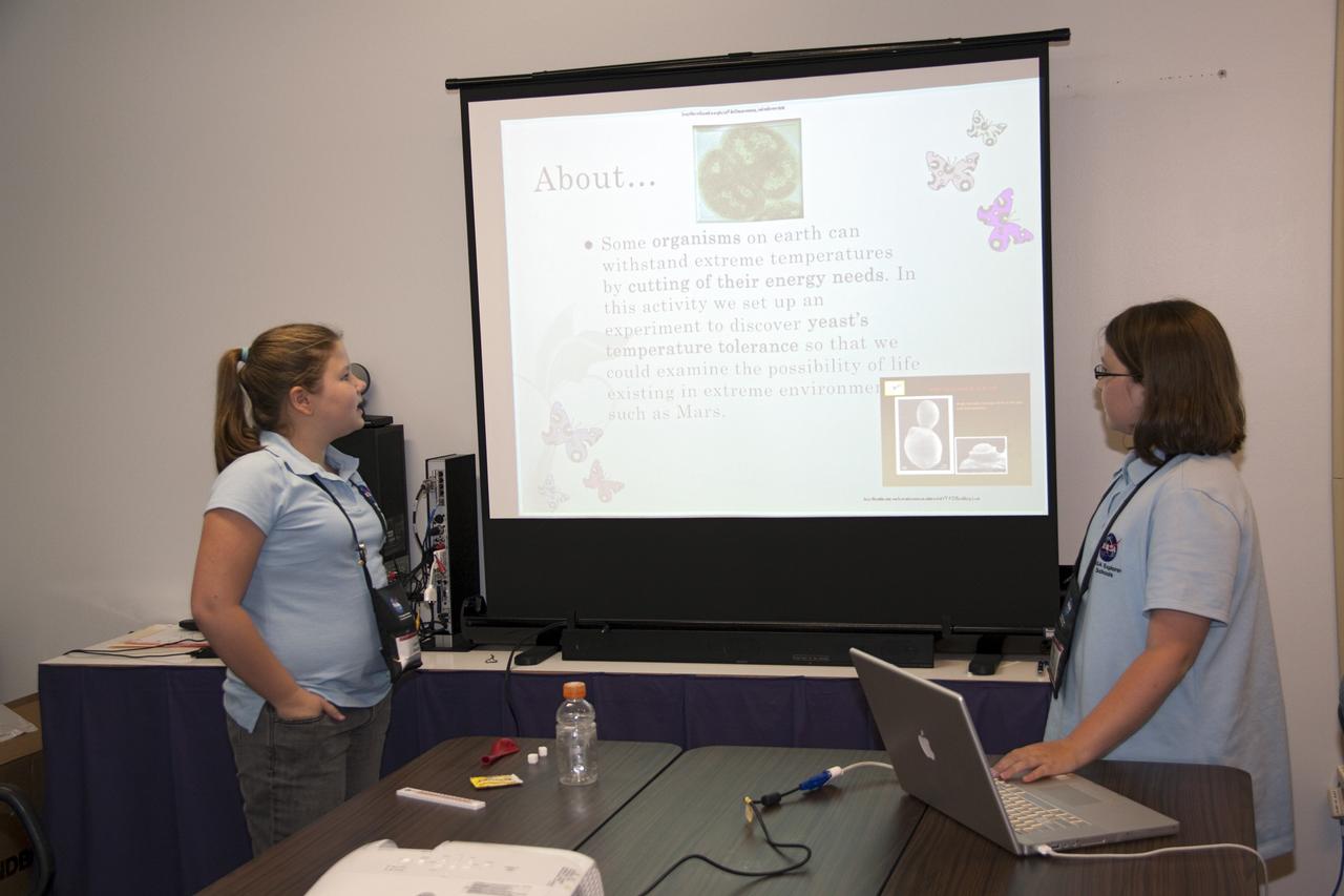CAPE CANAVERAL, Fla. -- Students present their investigation project to their peers, scientists, engineers and education specialists during the NASA Explorer Schools Symposium at Kennedy Space Center in Florida. About 60 fourth- through 12-grade students from across the nation are at the center May 4-7 participating in tours of processing and launch facilities and the U.S. Astronaut Hall of Fame, as well as several educational activities and a career panel question-and-answer session. About 30 teachers will receive professional development opportunities during the symposium. The participants were competitively selected after they completed an original investigation focused on existing NASA missions or research interests. Photo Credit: NASA/Jack Pfaller